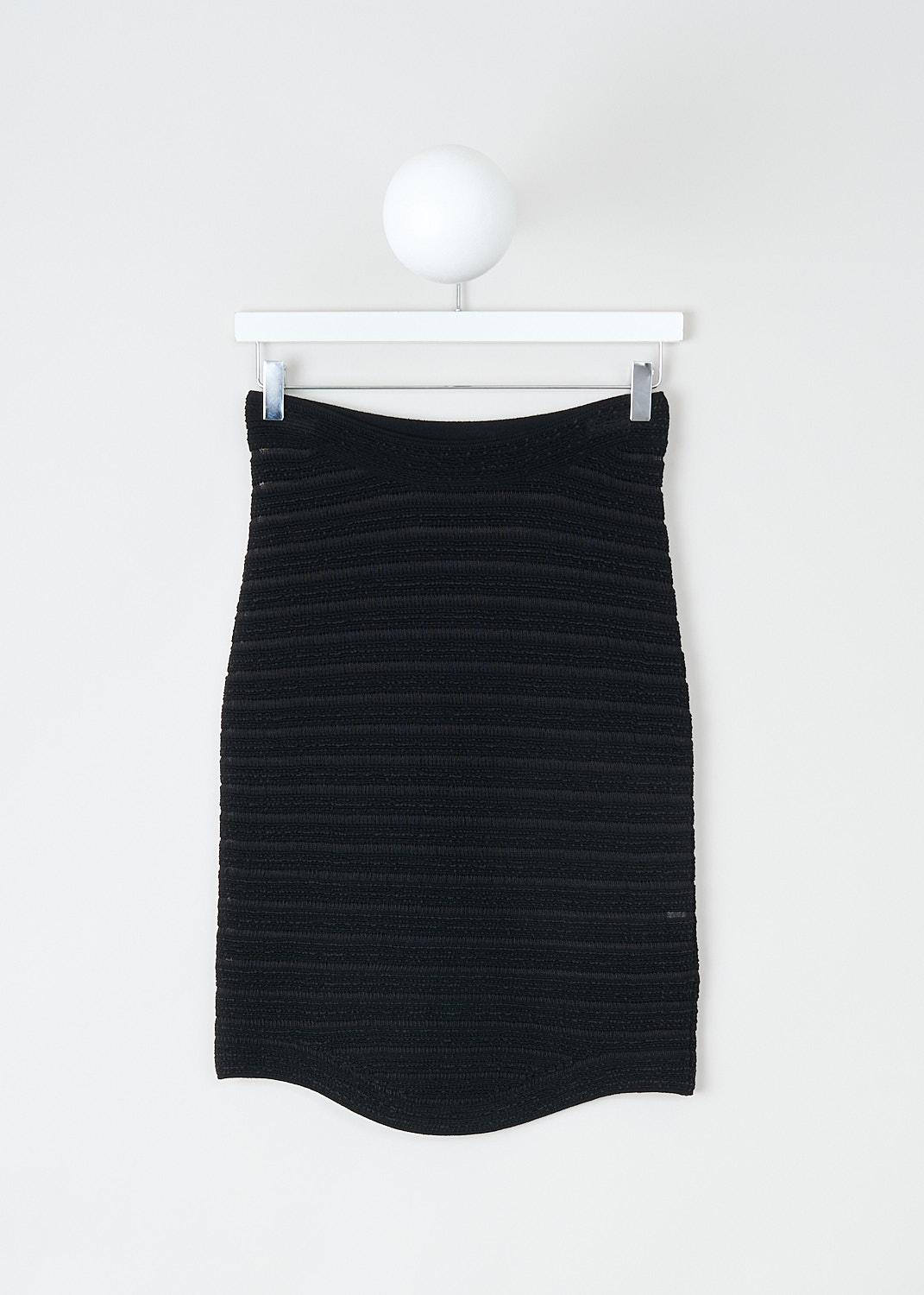 Alaïa, Black pencil skirt with horizontal stripes, 11CEMMAJ277_099_NOIR, Black, Front, This black pencil skirt has a wider elasticated waistband. The skirt has a striped pattern alternating between see-through and solid stripes. The hem is rounded hemline in the front and a straight hemline in the back
