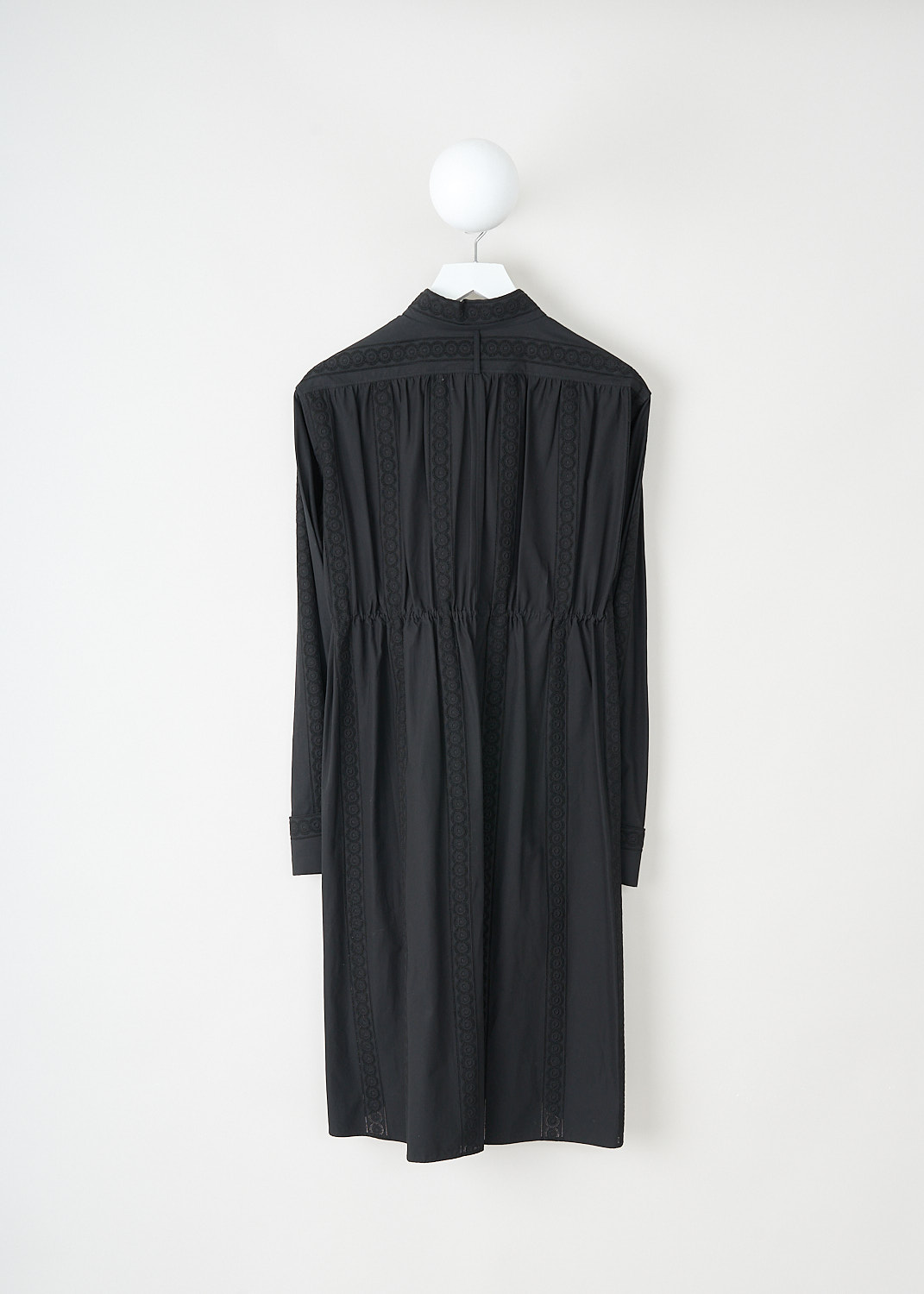 Alaïa, Black broderie anglaise shirt dress, 8S9C010LT200_C999_NOIR, Black, Back, This black shirt dress has a classic collar and a concealed front button closure. The long sleeves have buttoned cuffs. The drawstring can be tied in a bow and can be used to cinch in the waist. Broderie anglaise-trims decorate the whole of the dress.
