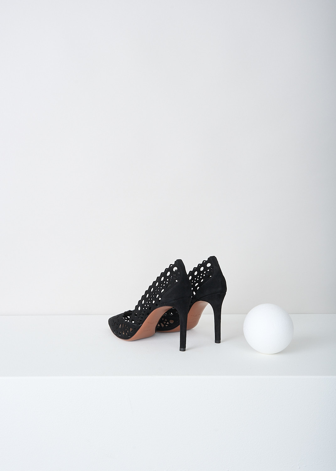 Alaïa, Black suede pumps with laser-cutouts, AA3E006C0H53_999_NOIR, Black, Back, The black suede pumps have a pointed toe. These open-work pumps have Vienne laser-cutout throughout. 
