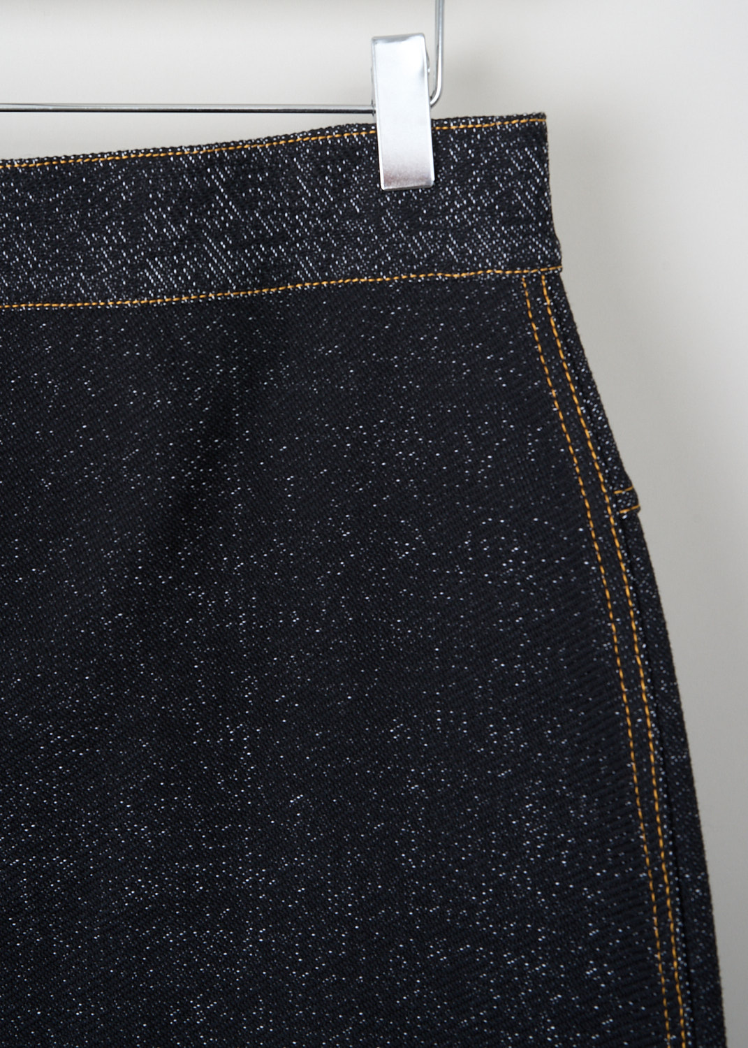 Alaïa, Denim-style pencil skirt, AA9J21654M823_991_NOIR_BLANC, Grey, Detail, This dark grey denim tube skirt has a concealed zip closure in the back. Orange stitching is used throughout. 
