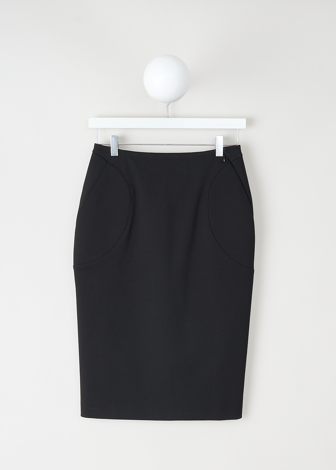 Alaïa, Black pencil skirt with padded inserts, AA9J05215T621_995_NOIR_ALAIA, Black, Front, This black midi pencil skirt has padded inserts on the front and back. A concealed zip runs diagonally from the front into the side seam. In thee back, the skirt has two concealed zips that can functions as slits.
