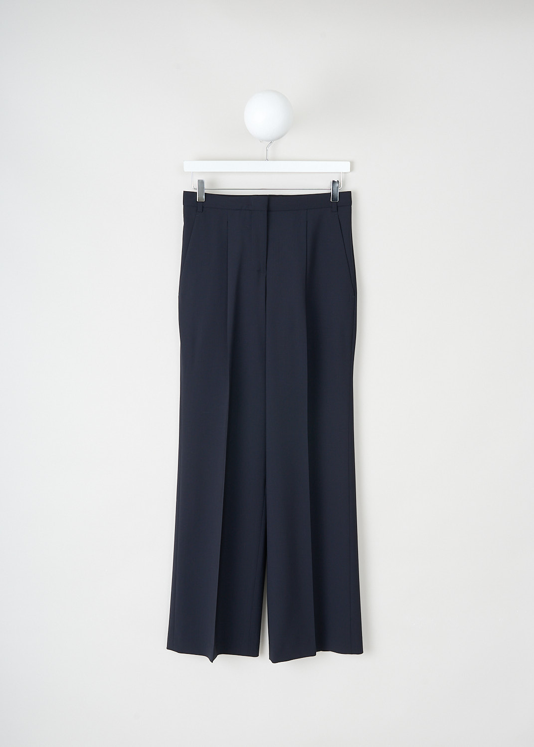 Aspesi, Front-pleated dark blue pants, 0115_V096_01098, Blue, Front, These front-pleated dark blue pants have a concealed belt loops and a clasp-and-zip closure. These pants have slanted pockets in the front and a single welt pocket in the back. The slightly flared pant legs have pressed creases. 
