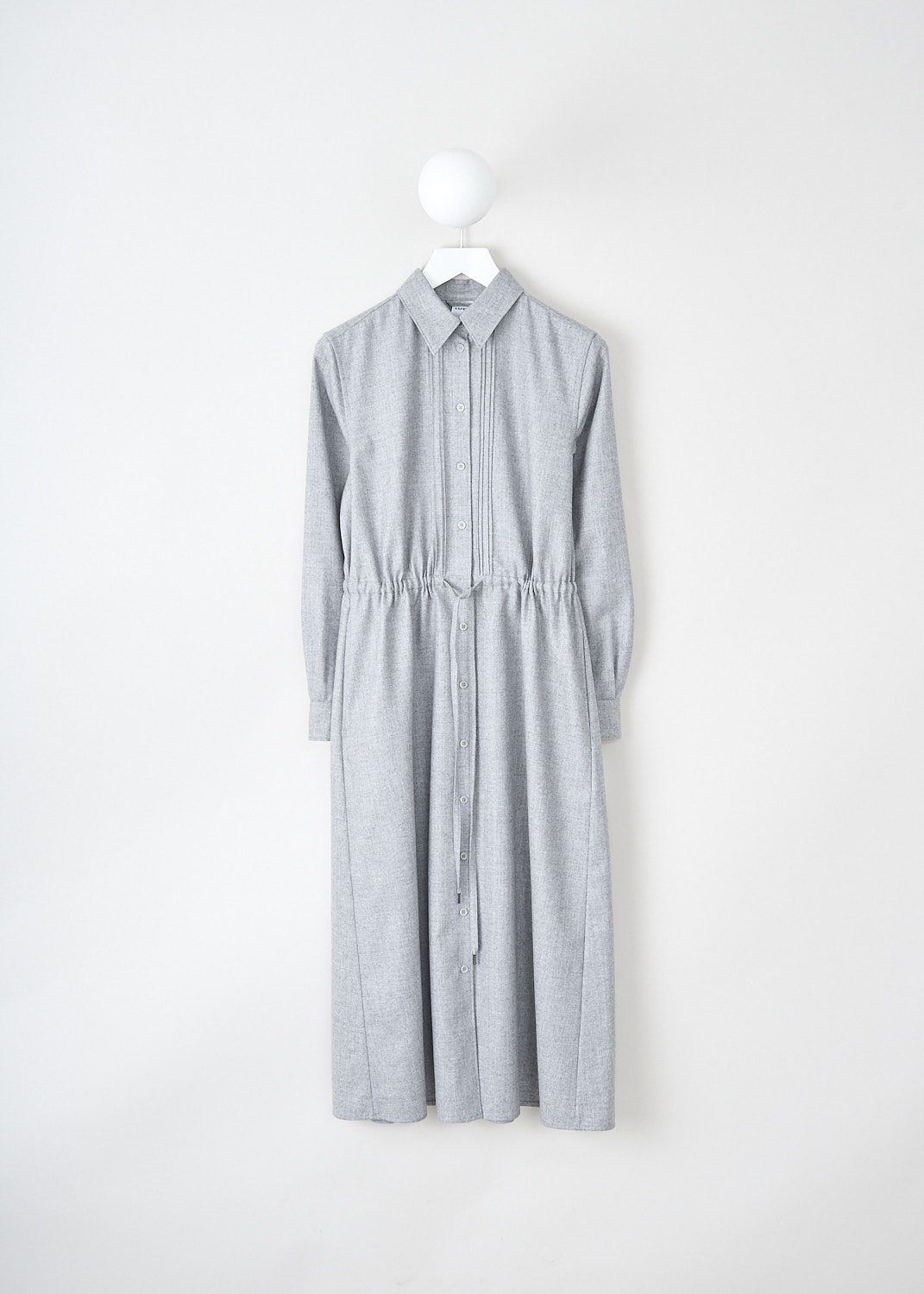 Aspesi, Light grey shirt dress, 2989_L629_01182, Grey, Front, This light grey shirt dress has a classic collar and a front button closure with pleats along the placket. The long sleeves have buttoned cuffs. Around the waist, the dress has a draw string to cinch in the waist. Slanted pockets are concealed in the side seam.
