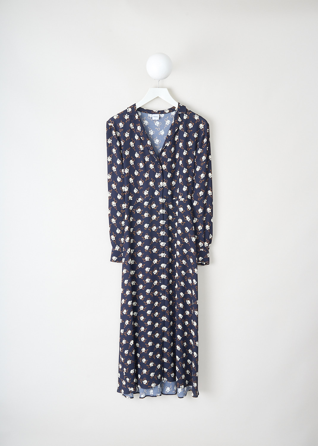 Navy blue midi dress with all over floral print in white and brown, V neckline, front button closure and long sleeves. Designer outlet piece available at Kiki’s Stocksale Maastricht luxury Aspesi dress.
