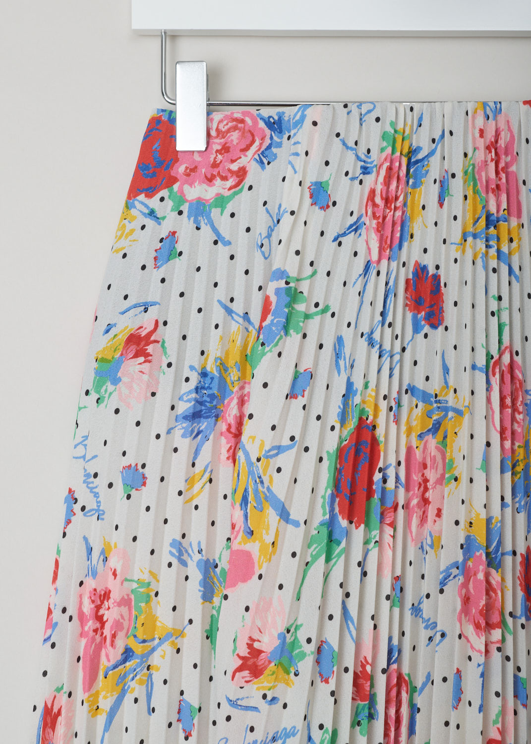 Balenciaga, Polka dot floral plissé skirt, 601169_THL07_9701, white red yellow green blue, detail. This high-waisted multi-colored plissé skirt comes with a floral design pattern and polka dots through-out. The closure options on this piece are 2 metal hooks and beneath that a concealed zipper.