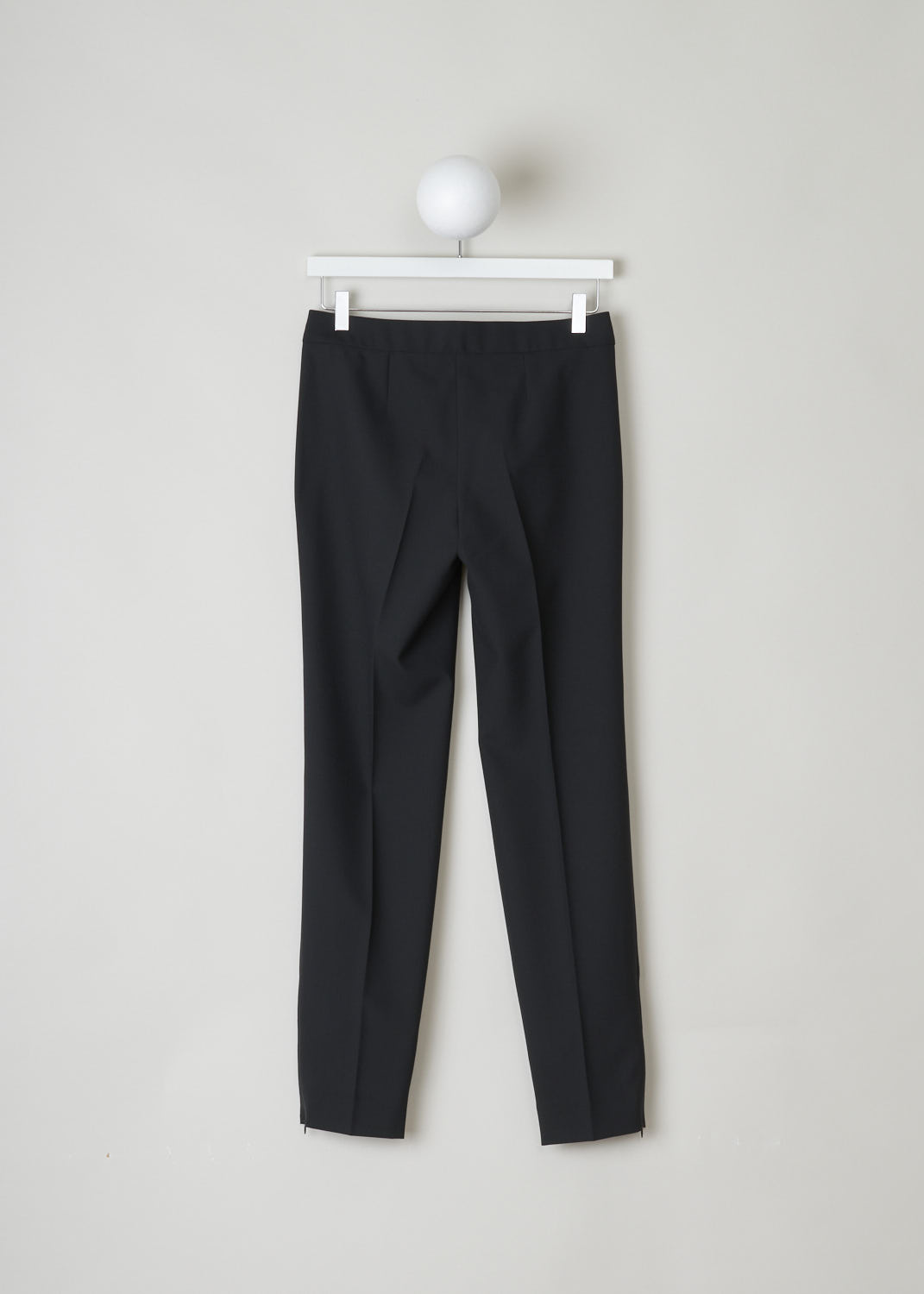 BALENCIAGA, CLASSIC BLACK PANTS WITH SUBTLE ZIPPER DETAIL, 329181_TCJ69_1000, Black, Back, This classic black pants has front creases along the length of the legs. These same creases can also be found on the back of the legs. On the front, welt pockets can be found on either side. On the ends of the legs, concealed zippers can be found that open to about ankle height.
