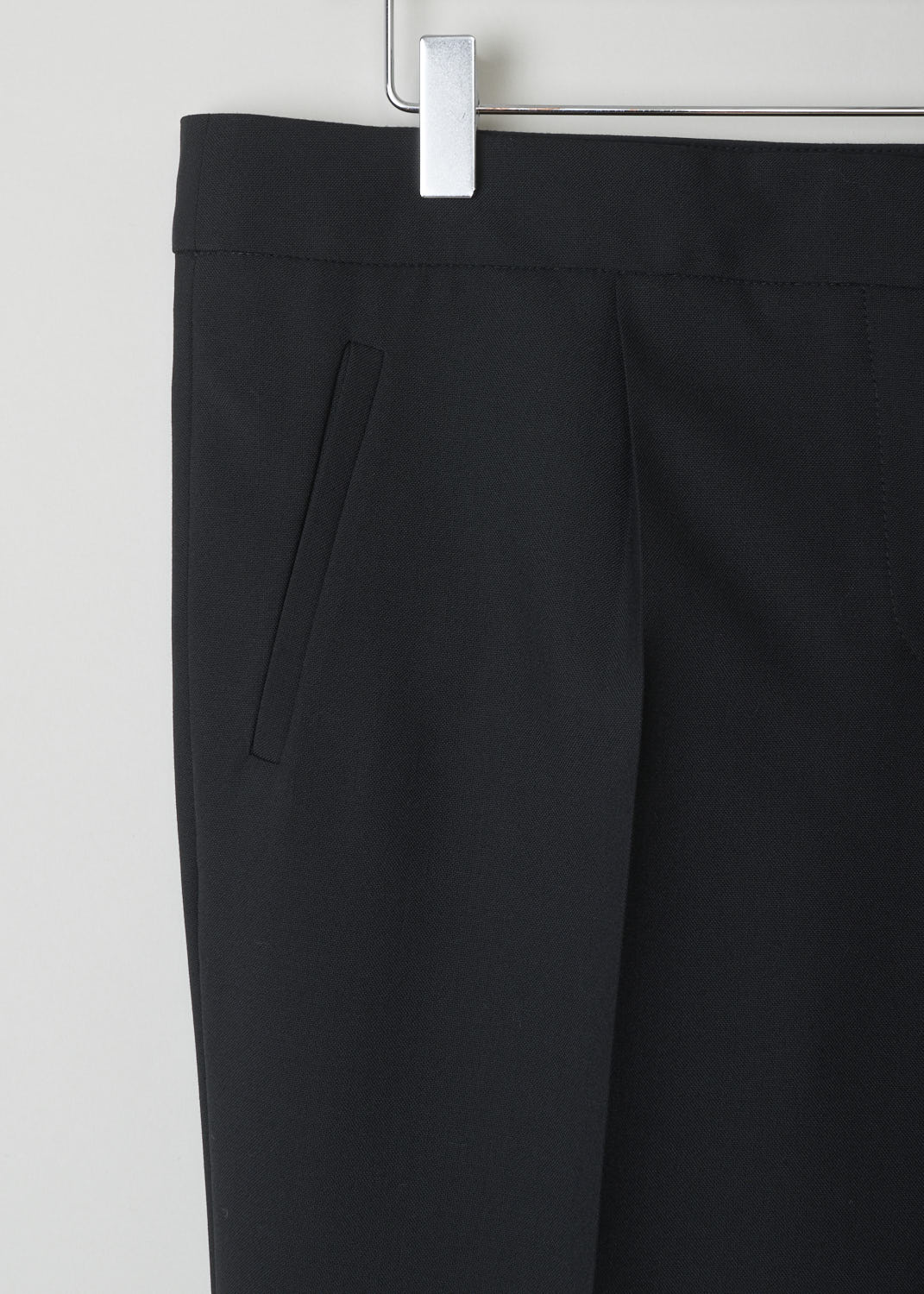 BALENCIAGA, CLASSIC BLACK PANTS WITH ZIPPER DETAIL, 329181_TCJ69_1000, Black, Detail, These classic black pants have front and back creases In the front, welt pockets can be found. On the ends of the legs, concealed zippers can be found that open to about ankle height.