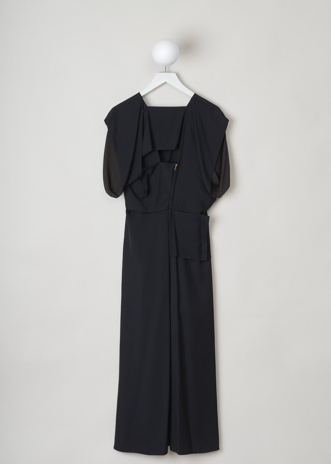 Bottega Veneta, Loose fitted black patchwork dress, 631461_VKUG0_1129, black, back, Loose fitted black dress, akin to a patchwork dress. Strikingly designed neckline, which is v-shaped with a squared off point. Another noticeable feature about this dress is the inverted short sleeve. Going further down the dress you will find a split on the front and back, cut to the same height, which give the illusion of it being a pants. Furthermore, a gold-tone zipper can be found on the back.