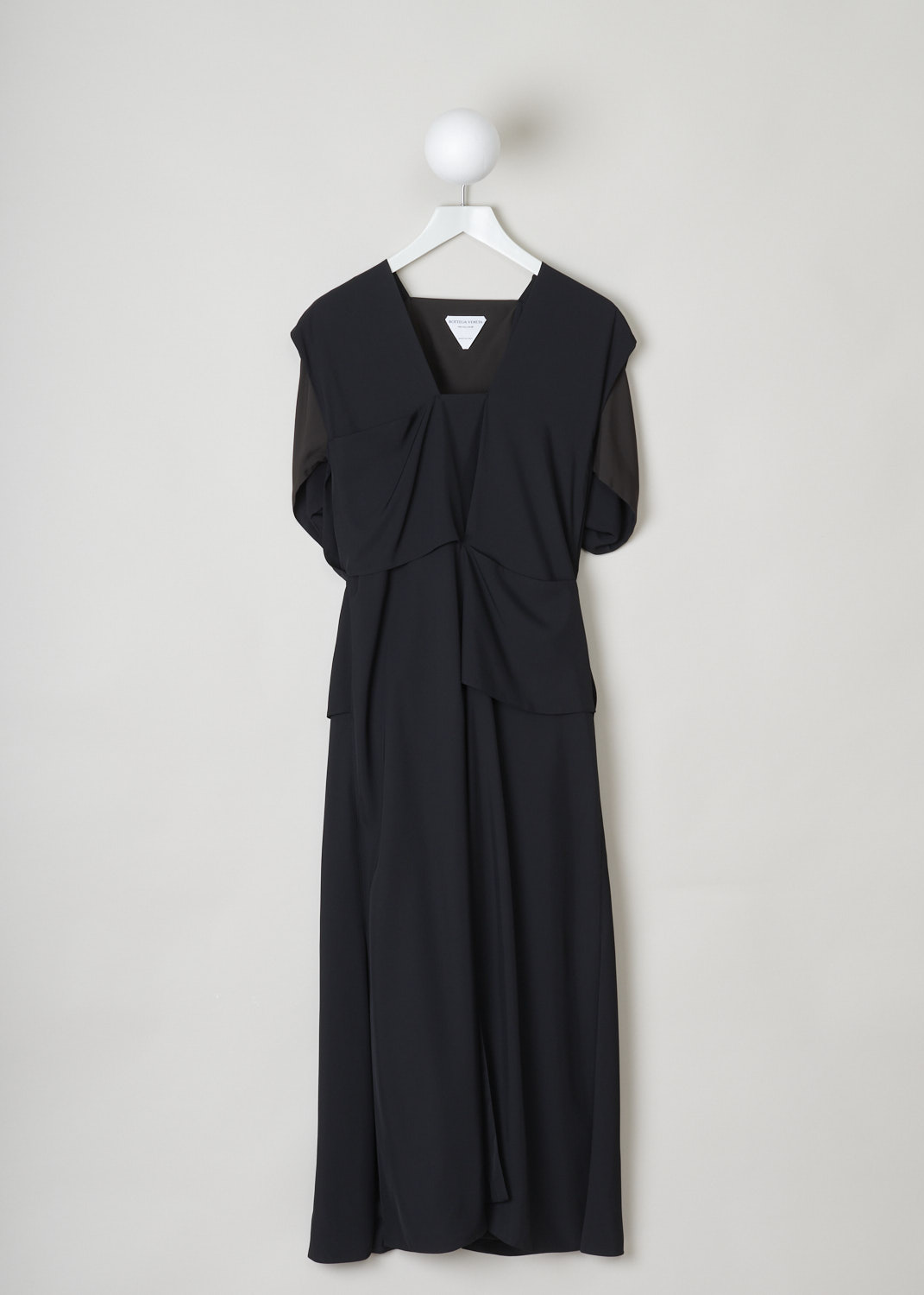 Bottega Veneta, Loose fitted black dress, 631461_VKUG0_1129, black, front, This loose-fitted black dress has a V-shaped neckline with a squared off point. This dress has an inverted short sleeve. The dress has a split in the front and back, cut to the same height, which gives the illusion of it being a pants. A gold-tone zipper can be found on the back.