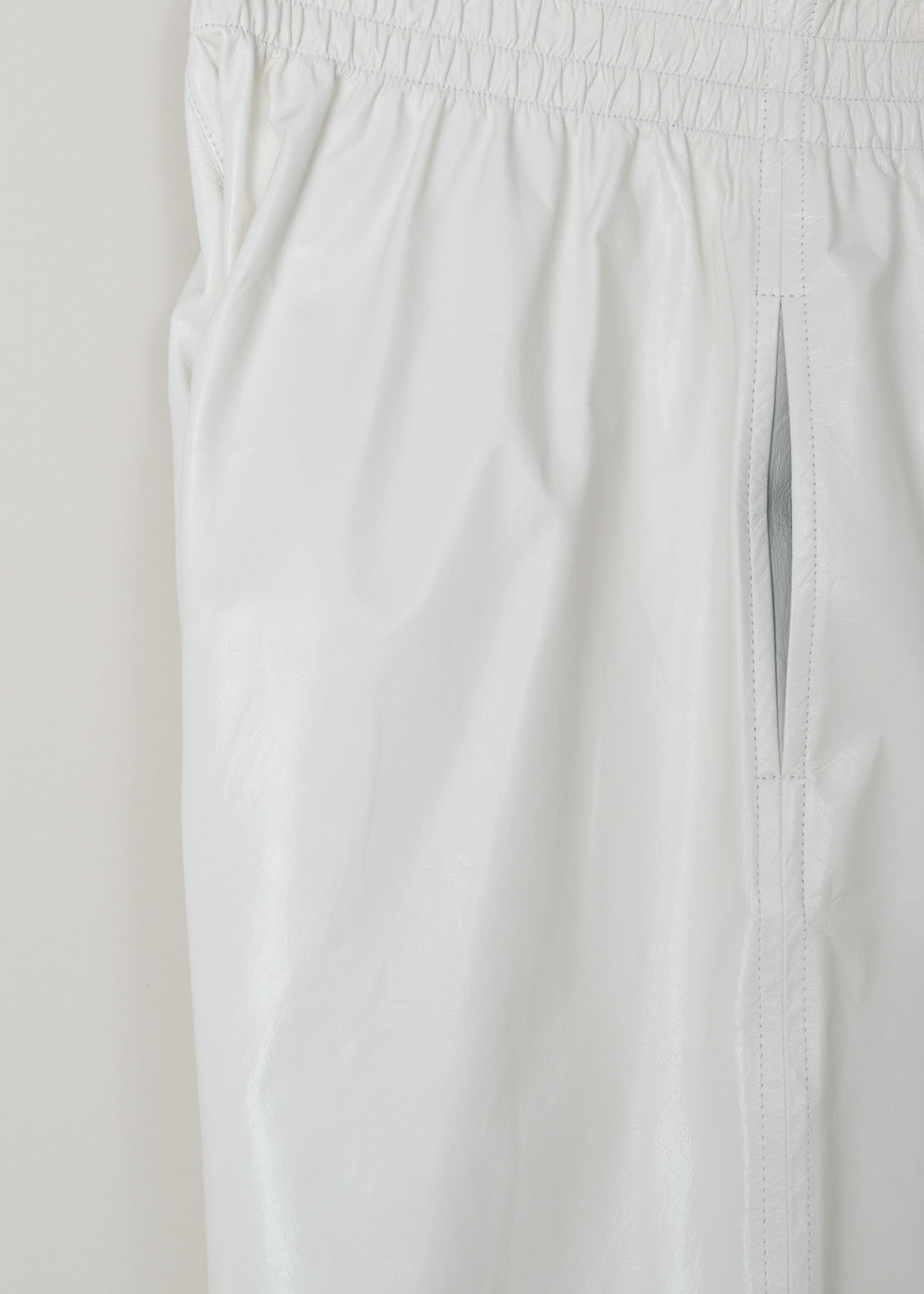 Bottega Veneta, White patent leather shorts, 633445_VKLC0_9068, White, Detail, These white patent leather shorts have an elastic waistband and slanted pockets. These shorts have an oversized silhouette. 

