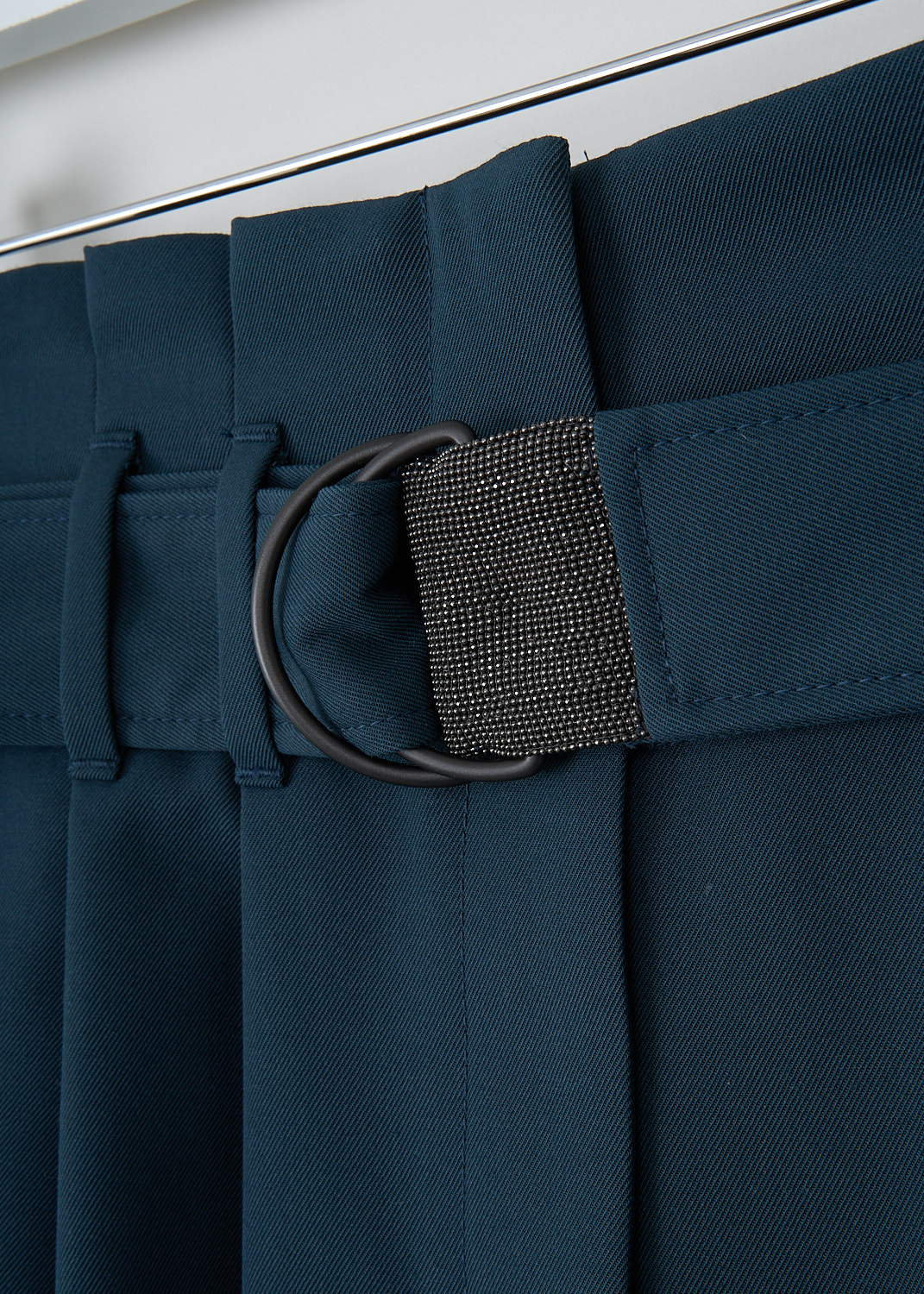 Brunello Cucinelli, High-waisted petrol pants, MP137P7024_C9310, 
Green, Blue, Detail, These high-waisted petrol-colored pants have a concealed zip closure. These pants come with a detachable fabric D-ring belt. The belt is subtly decorated with monili beading. Slanted pockets can be found in the front. The straight pants legs have knife pleats on the front and a folded hem. In the back, a single welt pocket can be found.
