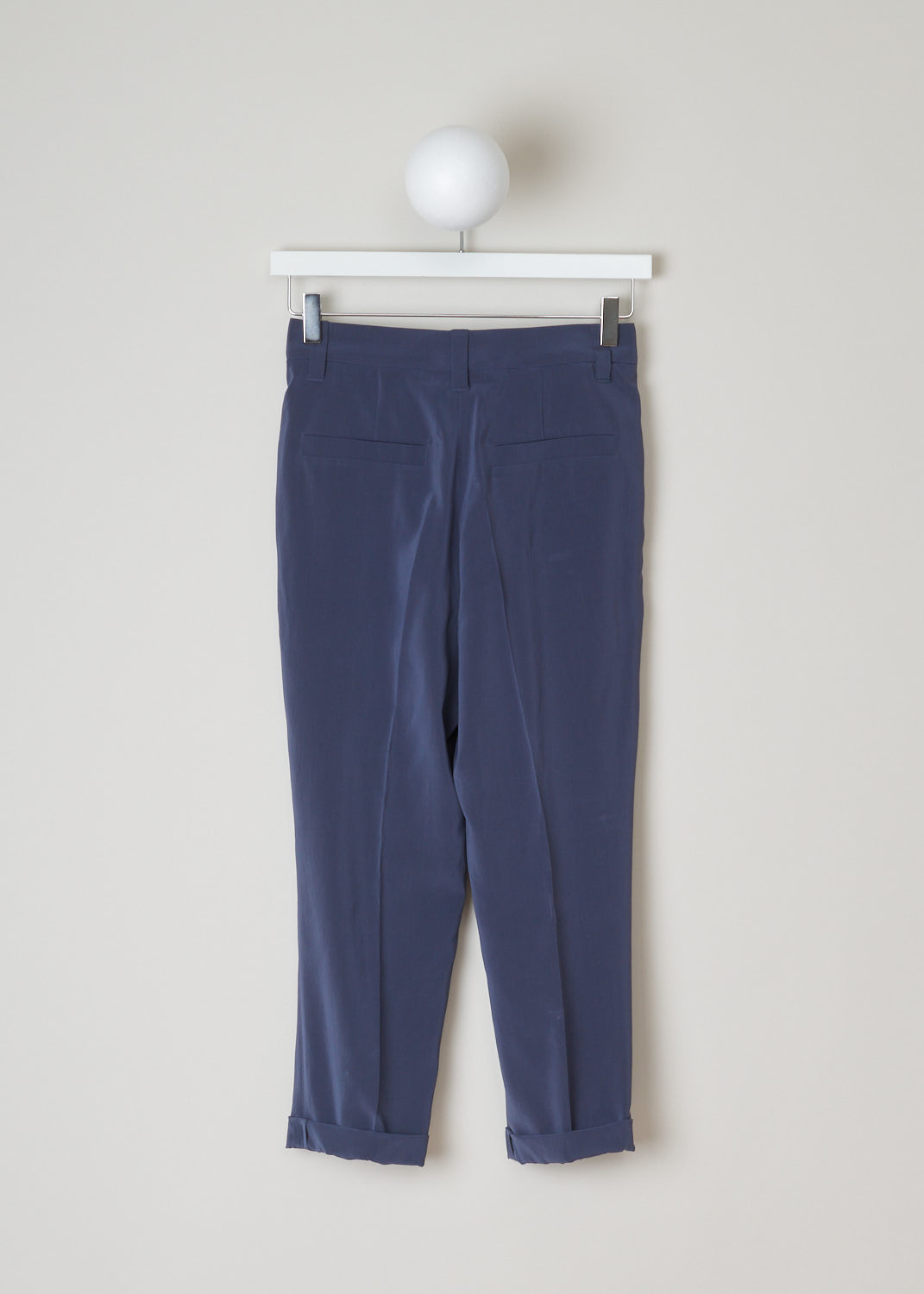Brunello Cucinelli, Blue silk pants, M0F51P1362_C2435, blue, back, Blue pants with a slight shine to it. Featuring a single pleat and forward slanted pockets. As your closure option this model has a zipper with a metal hook and a backing button. The cropped length with the rolled up hems just adds style to these pants. On the backside you will find two welt pockets.