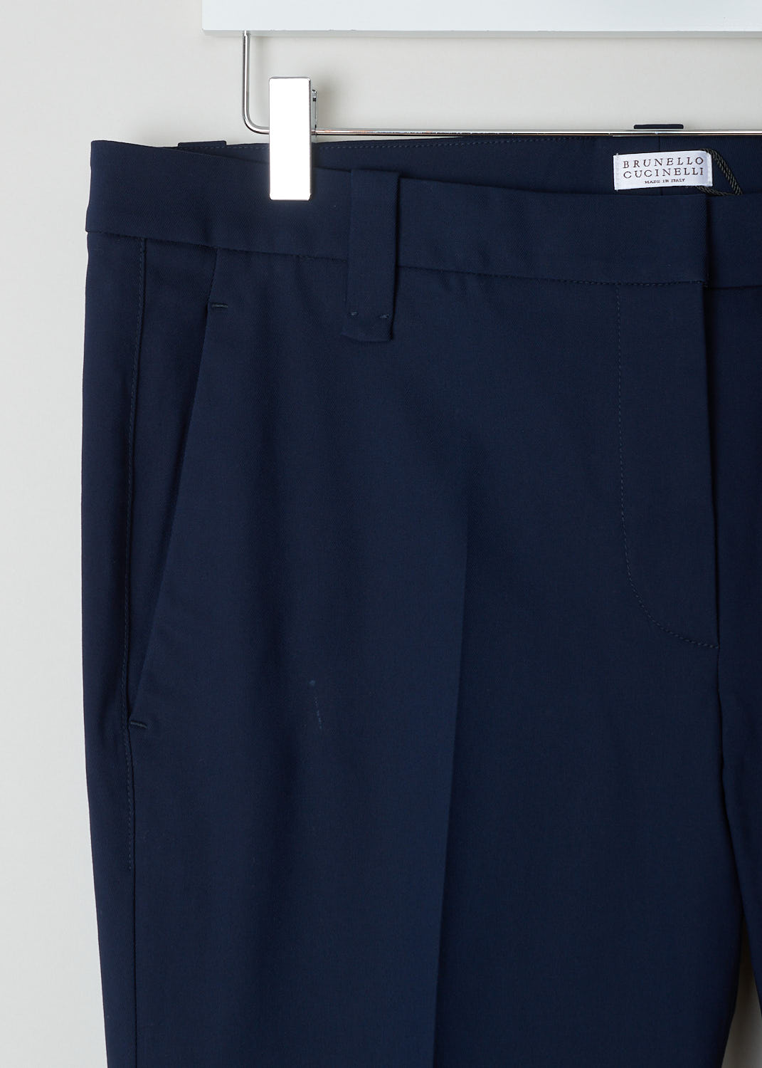 Brunello Cucinelli, Navy chino with fold-over hem, M0F70P1367_C7040, blue, detail, A navy chino made of a cotton blend. Featuring forward slanted pockets on the front, and two welt pockets on the back. furthermore the belt loops are a bit broader then usual. 