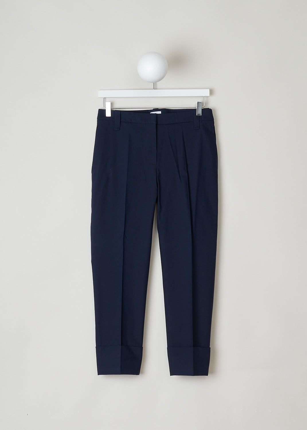 Brunello Cucinelli, Navy chino with fold-over hem, M0F70P1367_C7040, blue, front, A navy chino made of a cotton blend. Featuring forward slanted pockets on the front, and two welt pockets on the back. furthermore the belt loops are a bit broader then usual. 