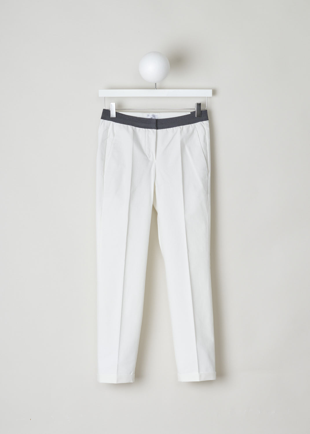 Brunello Cucinelli, White pants with grey elasticated waistband, M0F70P1500_C600, White, Front, These white pants feature a partly elasticated grey waistband, forward slanted pockets in the front and two buttoned welt pockets in the back. Along the length of the pant leg, centre creases can be found. These pants have a folded hem.
