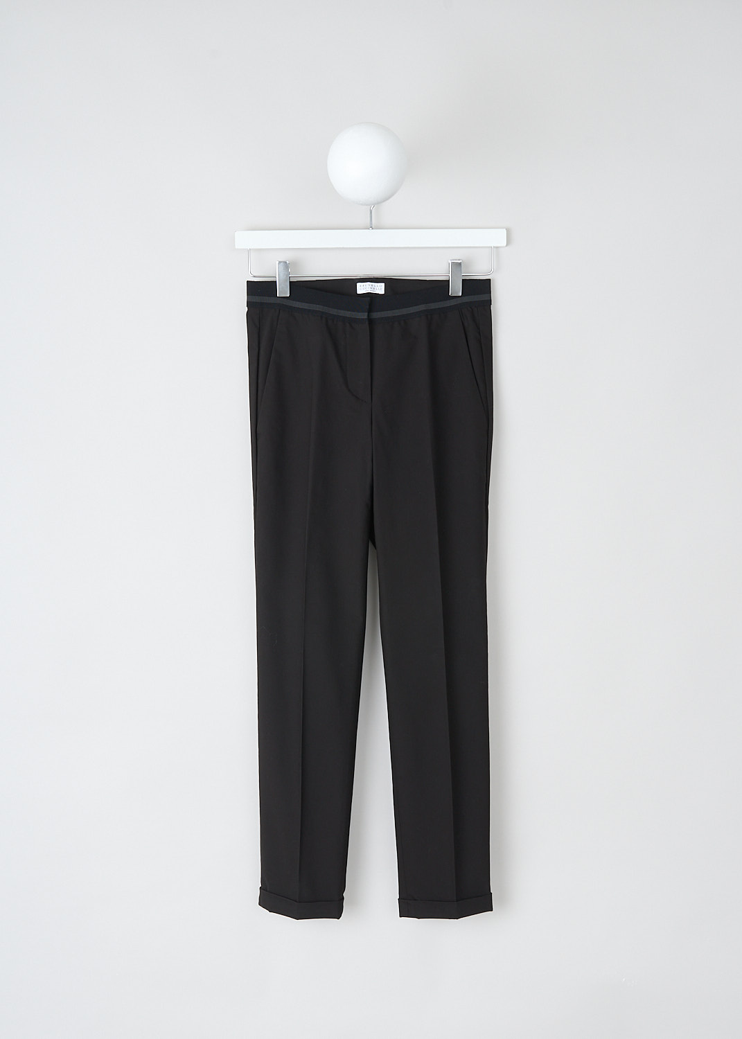Brunello Cucinelli, Black pants with partly elasticated waistband, M0F70P1500_CD531, Black, Front, These black pants feature a partly elasticated waistband, forward slanted pockets in the front, and two buttoned welt pockets in the back. Along the length of the pant leg, centre creases can be found. These pants have a folded hem.
