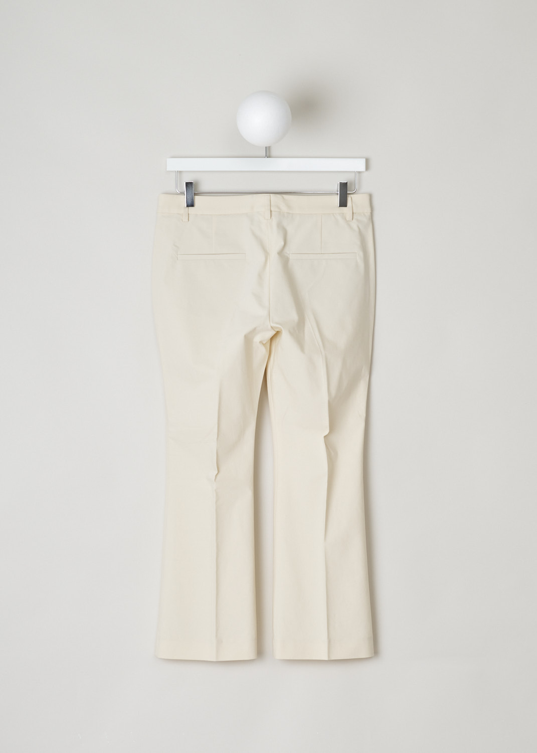 Brunello Cucinelli, Cream coloured boot-cut chino, M0F70P1951_C7070, beige, back, Made in the flat front model, with boot-cut legs. Furthermore, this model has two forward slanted pockets on the front and two jetted pockets on the back.
