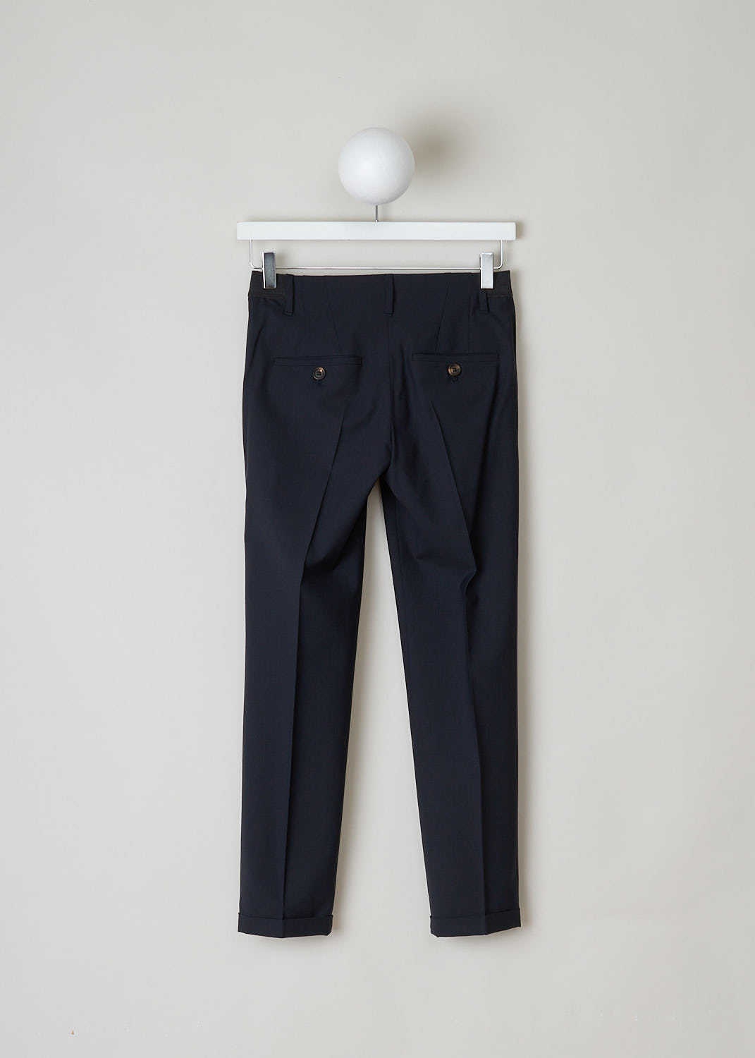 BRUNELLO CUCINELLI, NAVY BLUE PANTS WITH PARTY ELASTICATED WAISTBAND, M0W07P1500_C060, Blue, Back, Navy blue pants with partly elasticated waistline. A clasp and zipper function as the closing option. The pants feature forward slanted pockets in the front, and two buttoned welt pockets in the back. Along the length of the pant leg, centre creases can be found. These pants have a folded hem.
