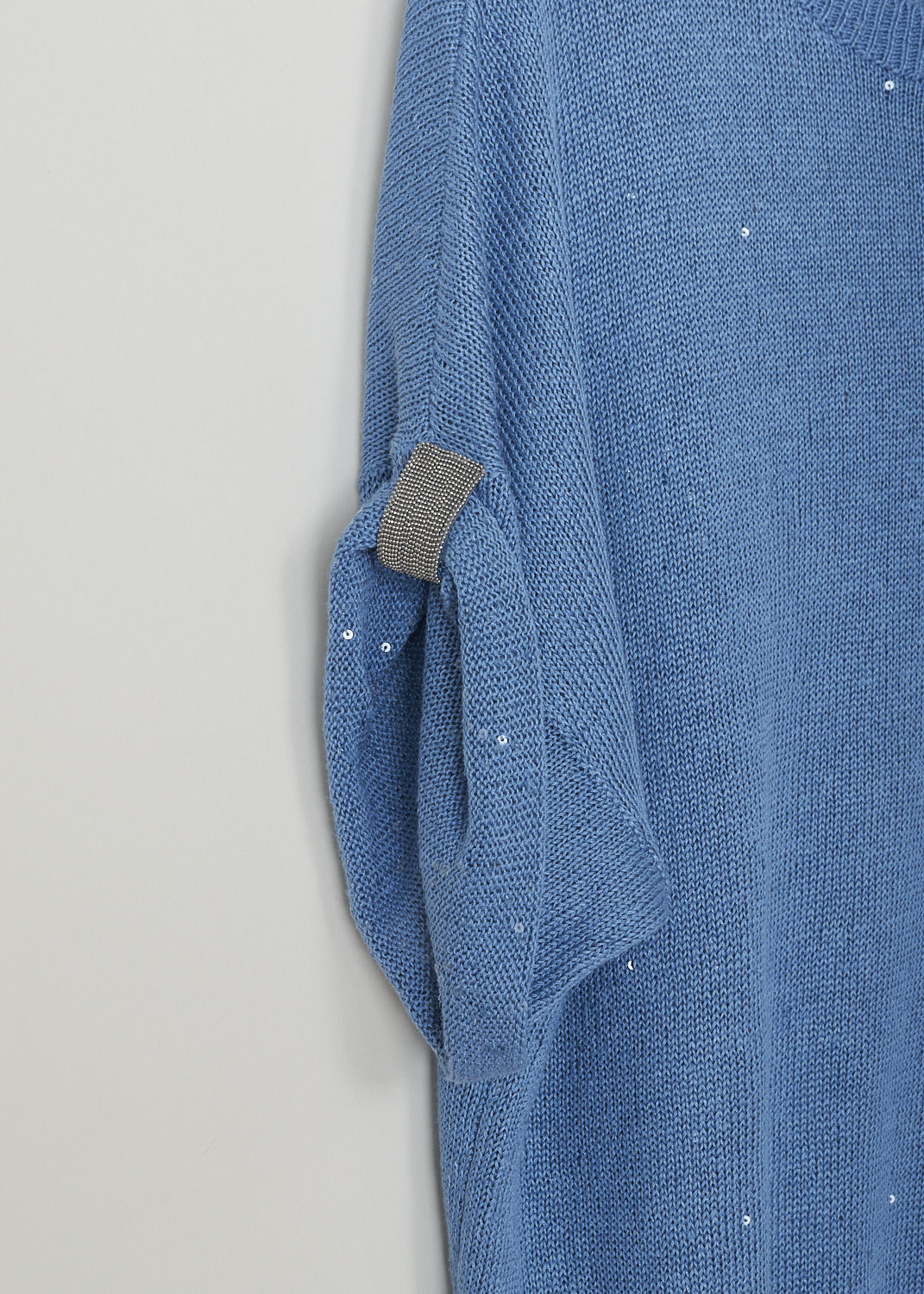 BRUNELLO CUCINELLI, LIGHT BLUE SWEATER WITH SEQUINS, M10552300_C9402, Blue, Detail, This short sleeve light blue sweater has sequins sewn-in throughout. The round neckline, cuffs and hemline have a ribbed finish. The short sleeves are folded and held in place with a monilli decorated strap.
