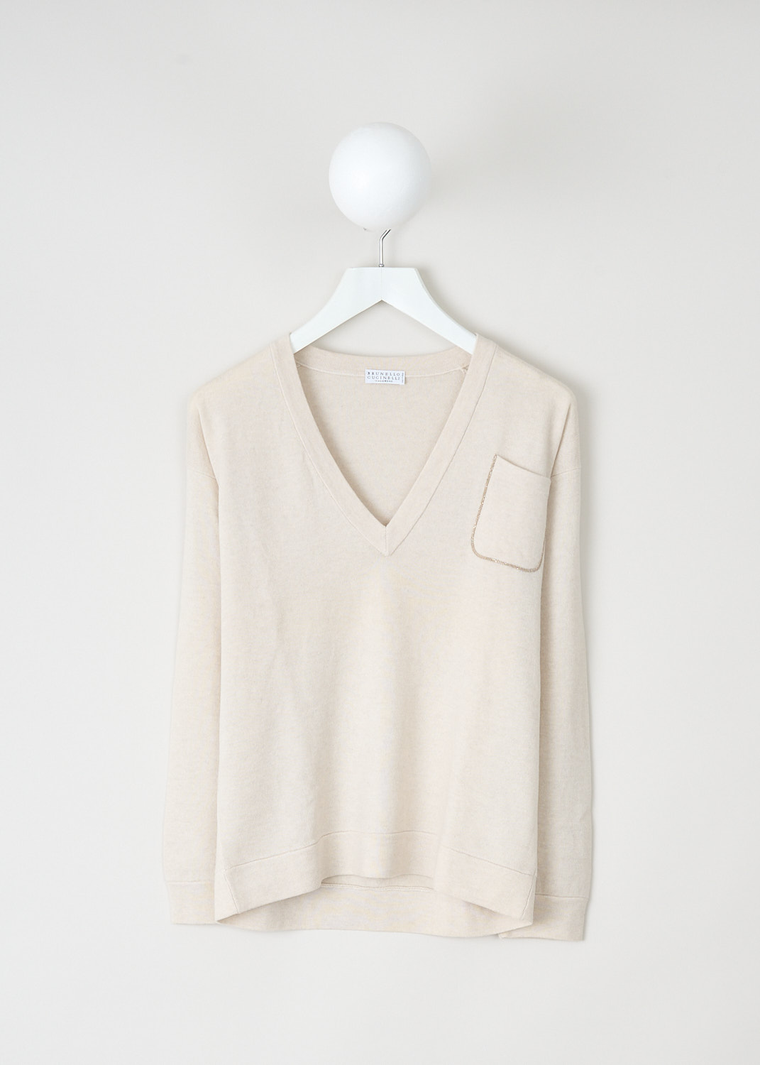 Brunello Cucinelli Off-white V-neck sweater, M12133602_CH257, White, Beige, Front, This off-white sweater has a V-neckline. The sweater has a monili-decorated breast pocket. Both the cuffs and the hem have a ribbed finish. The sweater has a high-low hemline.