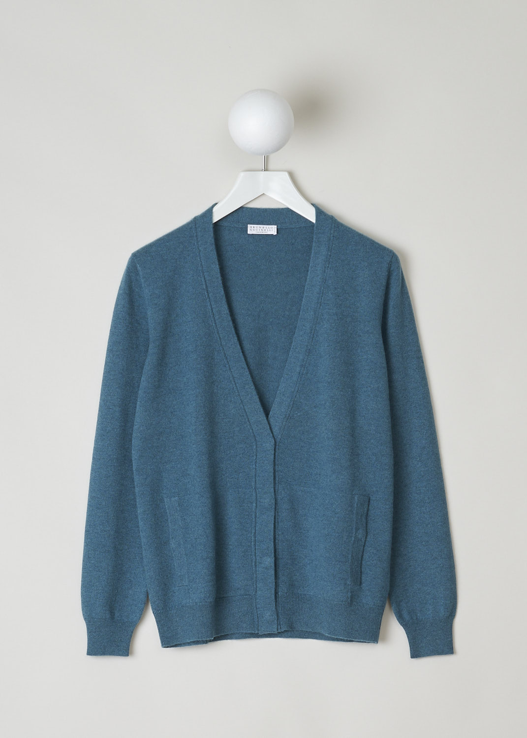 BRUNELLO CUCINELLI, TEAL GREEN CARDIGAN, M12144416_CC737, Green, Blue, Front, Teal green cardigan with a subtle monilli beaded trim in the back of the neck. The cardigan has a V-neckline and concealed front button closure with  press studs. The hemline and cuffs have a ribbed finish. The cardigan has patch pockets with press studs in the front. 
