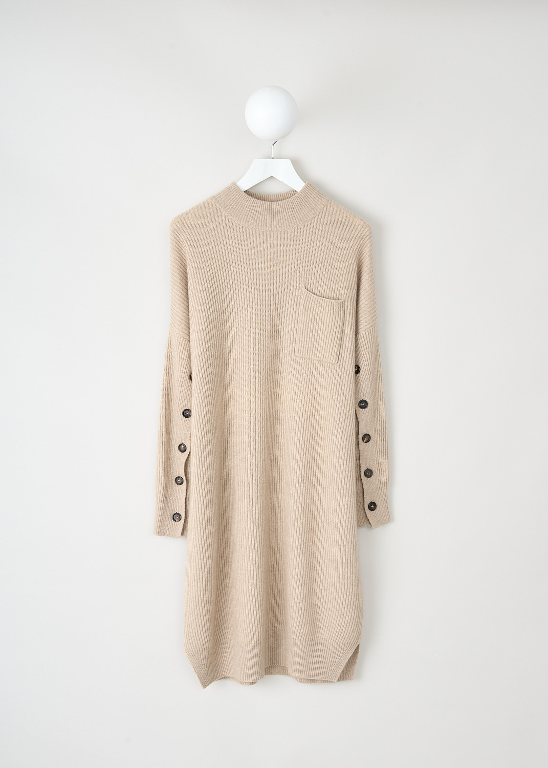 Brunello Cucinelli, Beige rib knit dress with buttoned sleeves, M12714A94_C077, Beige, Front, This beige rib knit dress has a round neckline and long sleeves with buttons on the inside of the arm. On the front, the dress has a single breast pocket. The dress has a straight hemline. 

