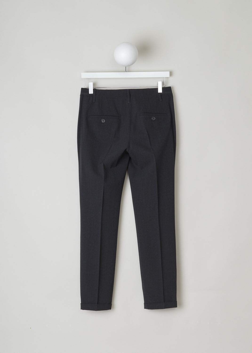BRUNELLO CUCINELLI, DARK GREY PANTS WITH PARTIALLY ELASTICATED WAISTBAND, MA051P1500_CB415, Grey, Back, Dark grey pants with partly elasticated waistline. A clasp and zipper function as the closing option. These pants feature forward slanted pockets in the front, and two buttoned welt pockets in the back. Along the length of the pant leg, centre creases can be found. These pants have a folded hem.

