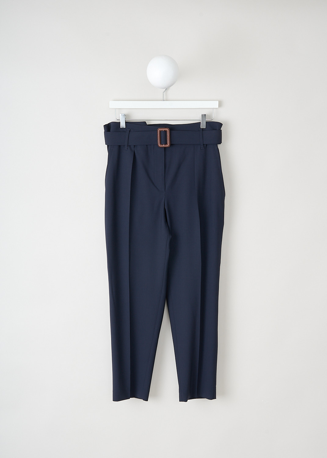 Brunello Cucinelli, Navy blue wool pants with matching belt, MA105P6899_C1359, Blue, Front, These navy blue wool pants have an elasticated waist, a concealed clasp and zipper closure and a matching fabric belt with a brown leather buckle. These pants have a pleated front and tapered pant legs with centre creases. In the front, slanted pockets can be found. In the back, these pants have welt pockets. 

