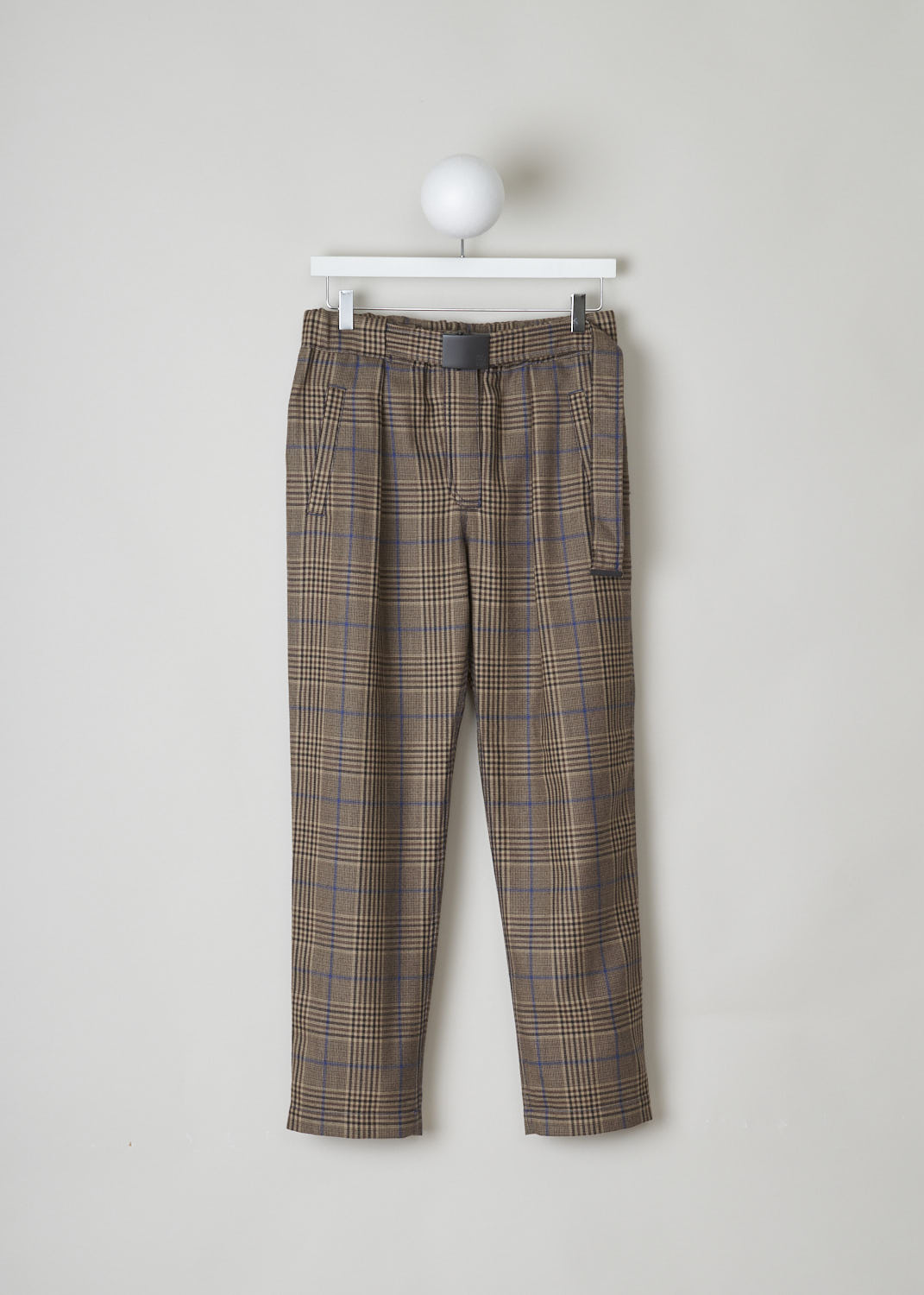 BRUNELLO CUCINELLI, WOOL CHECKED PANTS WITH BLUE THREADING, MA111P6823_C2373, Brown, Front, These brown checkered wool trousers feature an elasticated waistband with a built-in belt in the same checkered fabric. The belt has a black rectangular clasp. These trousers have slanted pockets and a pleated front and slightly tapered pant legs. In the back, two welt pockets can be found. 

