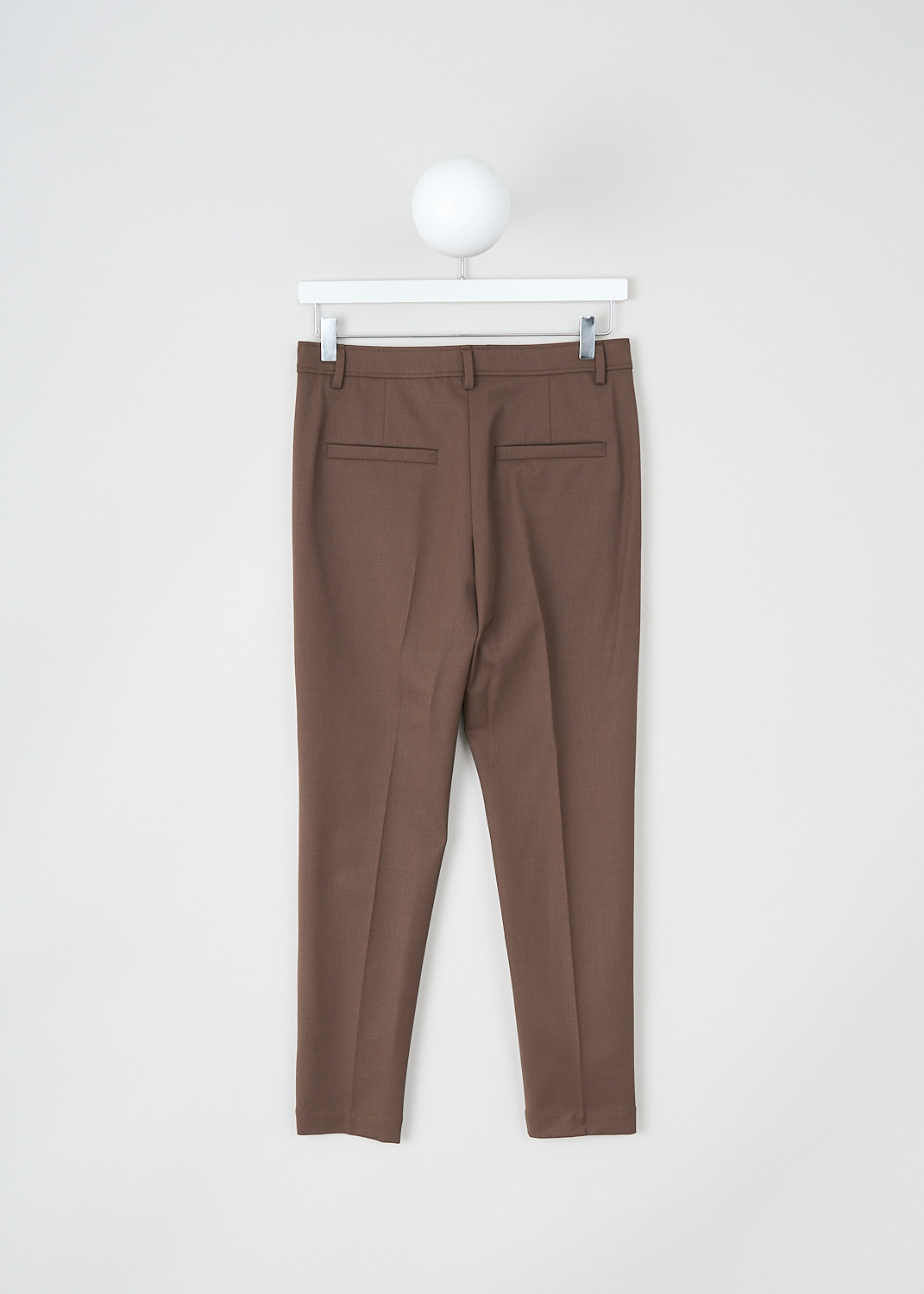 Brunello Cucinelli, Brown tapered pants with subtle monili beading, MB526P6572_C8504, Brown, Back, These brown wool mid-rise pants have a waistband with belt lops, one of which is subtly decorated with monili beading. The waistband has an incorporated belt. In the front, these pants have slanted pockets, The tapered, ankle length pants legs have pressed creases. In the back, these pants have welt pockets  
