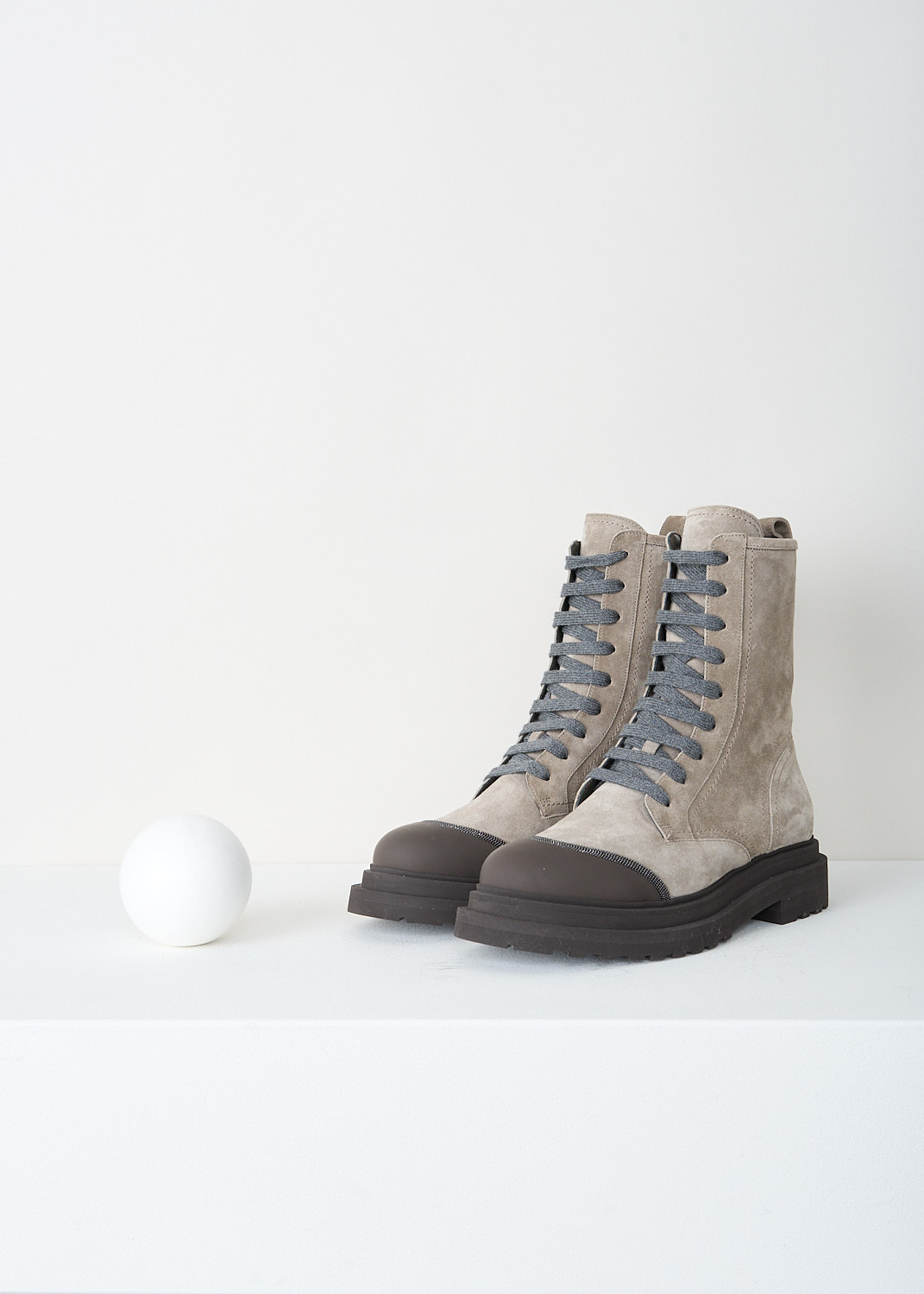 Brunello Cucinelli, Light grey boots with dark brown toe cap, MZSFG2518_CBT71, Brown, Front, These light grey suede ankle boots feature both a lace-up front and a zip closure. A pull tab lines the topline, and a brown rubber toe cap with monili trim extends seamlessly into the chunky sole with a low heel.
