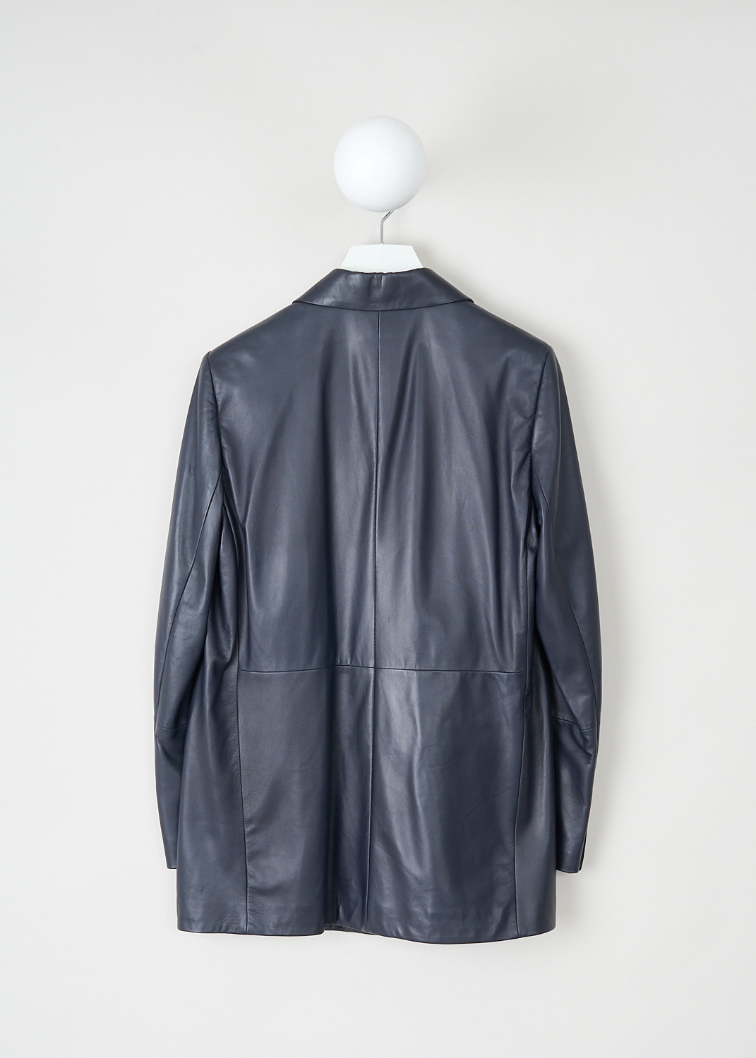 Brunello Cucinelli, Blue leather blazer, MPTAN2104_C7186, Blue, Back, This blue leather blazer has a peaked lapel and a concealed front button closure. The long sleeves have buttoned cuffs. On the front, the jacket has two flap welt pockets and a single breast pocket. The jacket has a paneled look.
