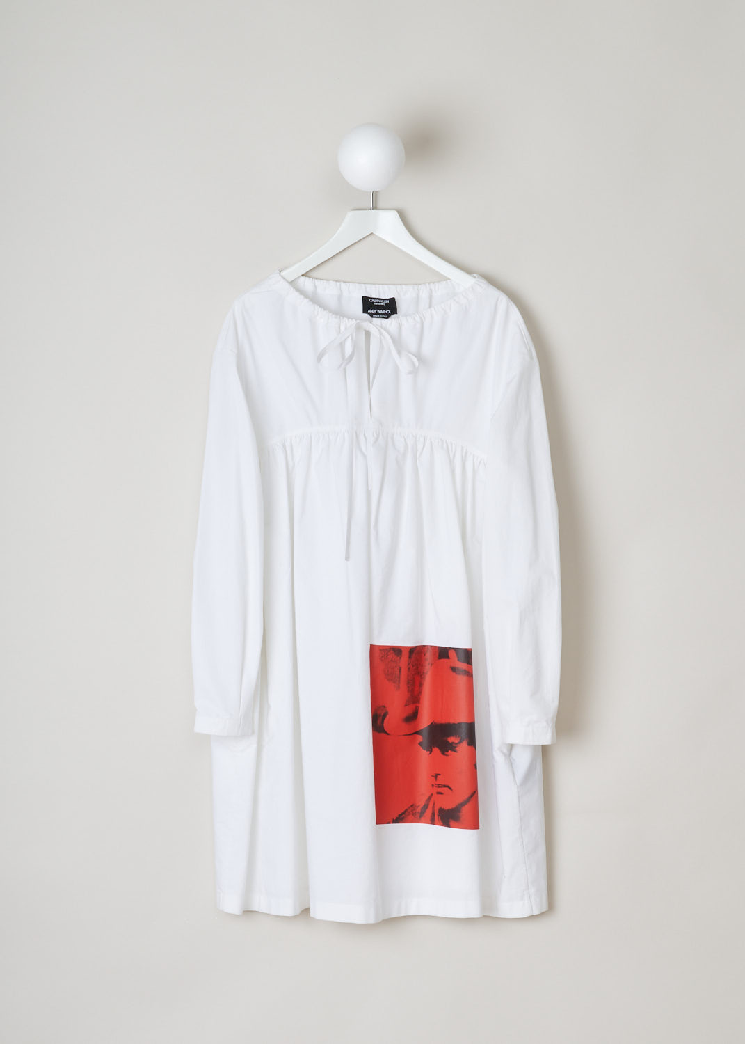 Calvin Klein 205w39nyc, White tent dress, 82WWDD16_C038_100, white red, front, White dress featuring a red Andy Warhol print on the front. Comes with a drawstring tunnel at the neckline to adjust the width. A similar drawstring tunnel can be found at chest height. The long sleeves are cuffed without any buttons. 
There are two pockets on each of the side seams.