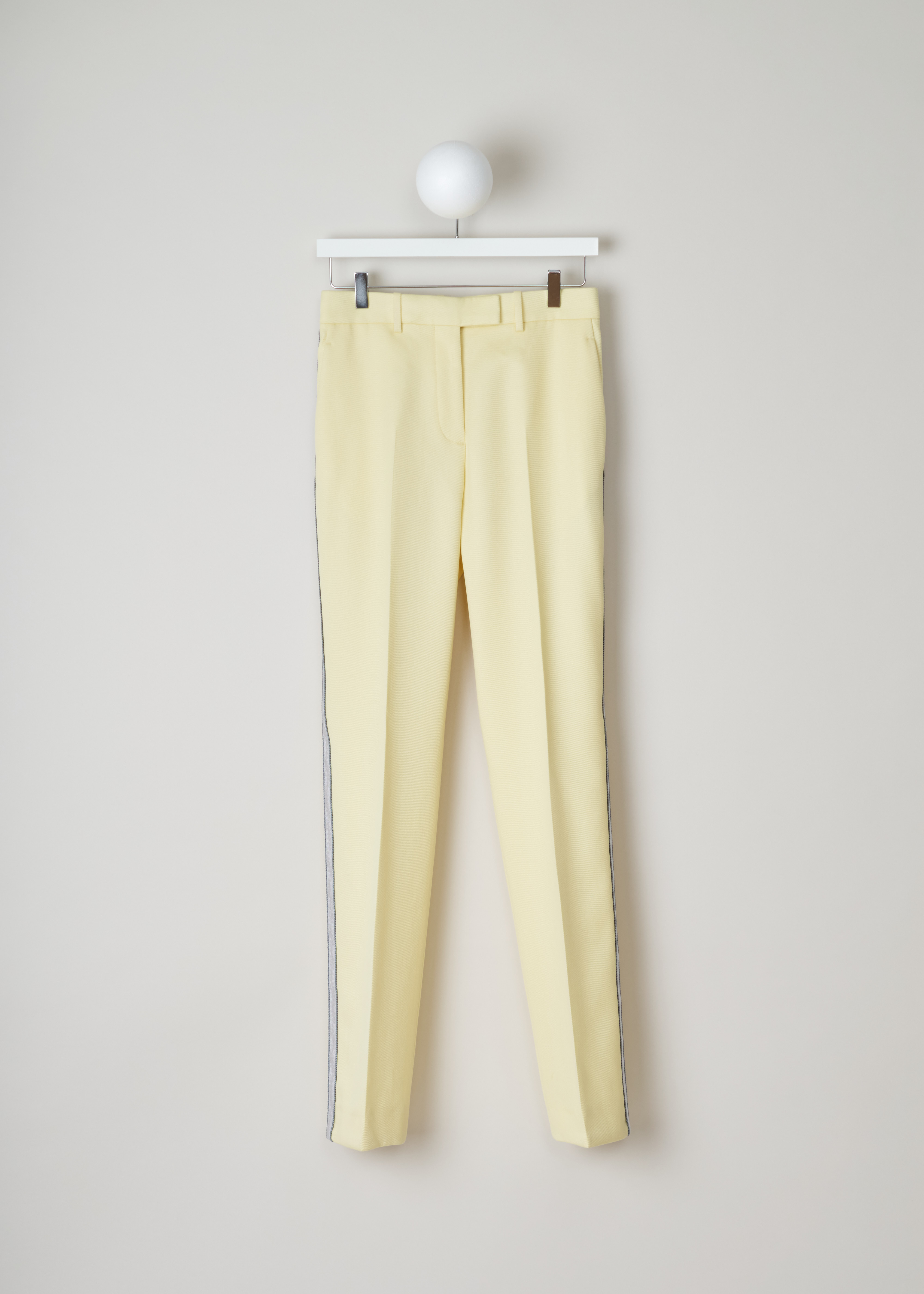Calvin Klein 205W39NYC Yellow pants with ribbon trim 84WWPB22_W037_764 light yellow pearl front. Yellow trousers with side piping in white and blue, centre creases, side pockets and a welt pocket on the back.