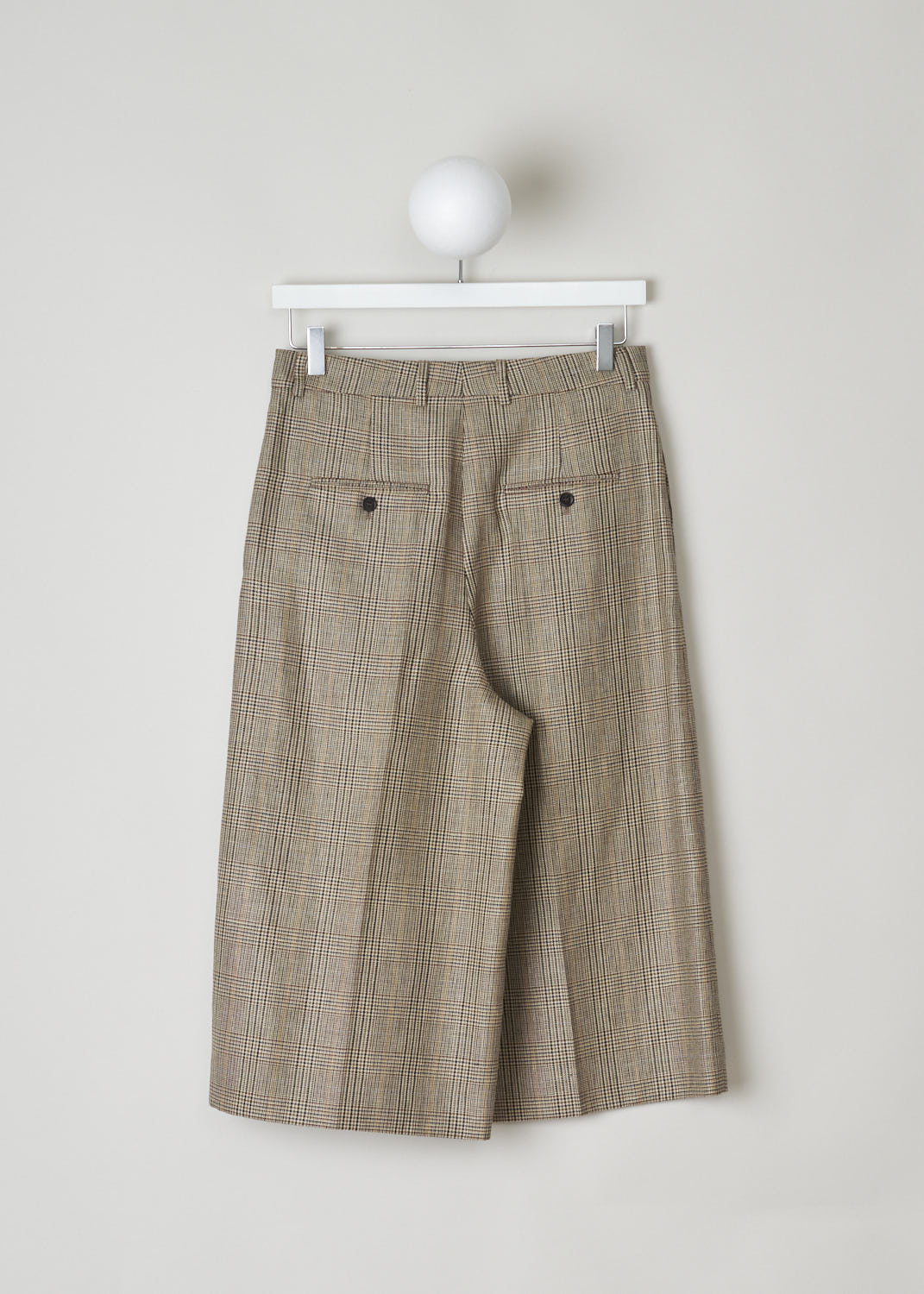 CELINE, BROWN CHECKERED CULOTTES, 024I_2P233_12MC, Brown, Back, Brown checkered culottes made from wool. These pants have belt loops and the closing option on this model is a concealed hook, button and zipper. Along the length of the pant legs, creases can be found. These pants have slanted pockets in the front and two buttoned welt pockets in the back.

