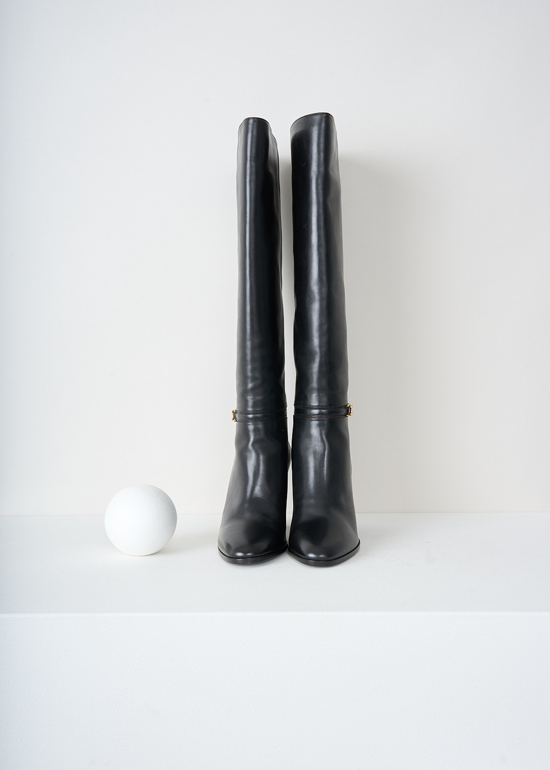 Top view of the black Celine knee-high boots highlighting almond toe and leather finish, available at Kiki's Stocksale in Maastricht.