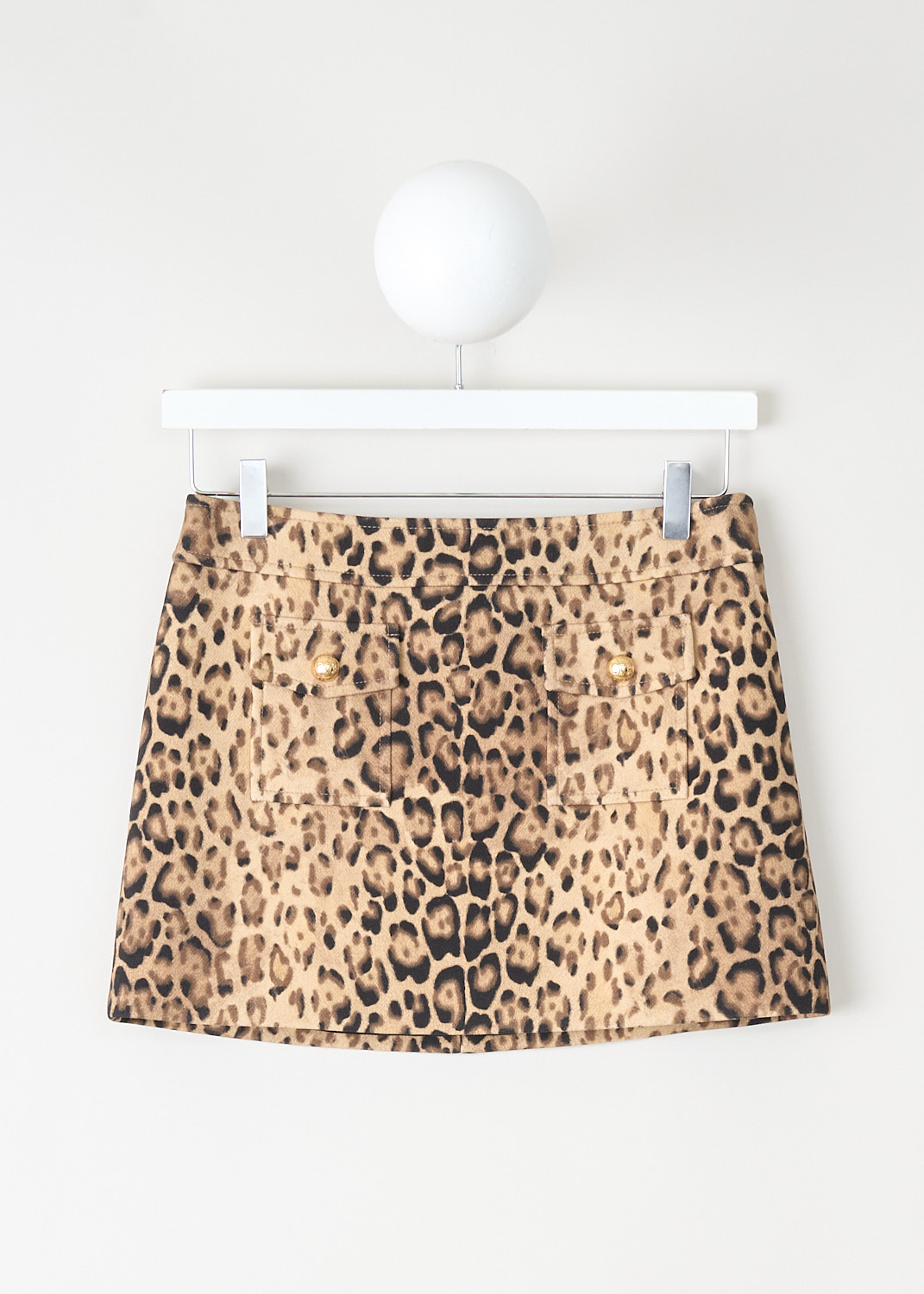 Leopard print mini skirt by Celine in wool and cotton blend with front patch pockets and gold-tone button details, tailored luxury design.