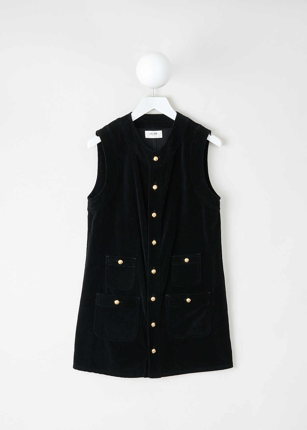 Black velvet sleeveless dress by Celine with round neckline, gold-tone button closure and patch pockets, Kiki’s Stocksale Maastricht designer outlet.