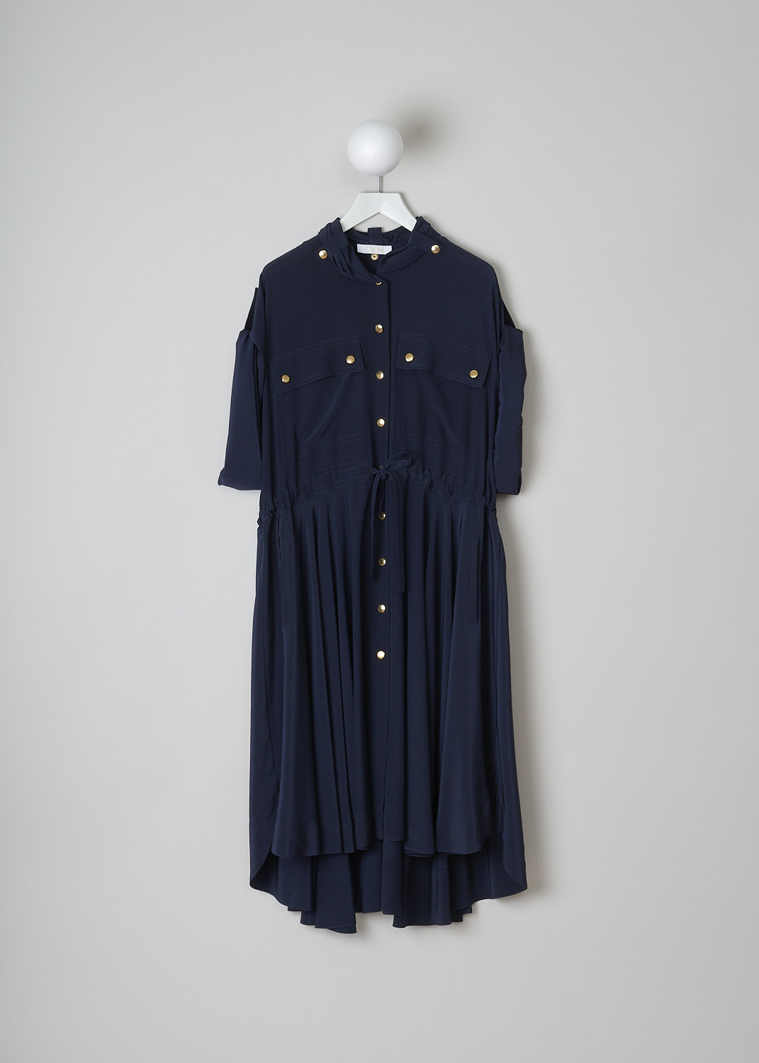CHLOÃ‰, INK NAVY DRESS WITH GOLD-TONE BUTTONS, CHC19SRO510044C3_INK_NAVY, Blue, Front, This Ink navy silk maxi dress has gold-tone snap buttons throughout. The dress has a gathered collar with snap buttons and a front snap button closure. The wide long sleeves can be rolled up with snap buttons. On the front, the dress has two buttoned patch pockets and slanted pockets. A drawstring can be used to cinch in the waist. The dress has an asymmetric hemline.    
