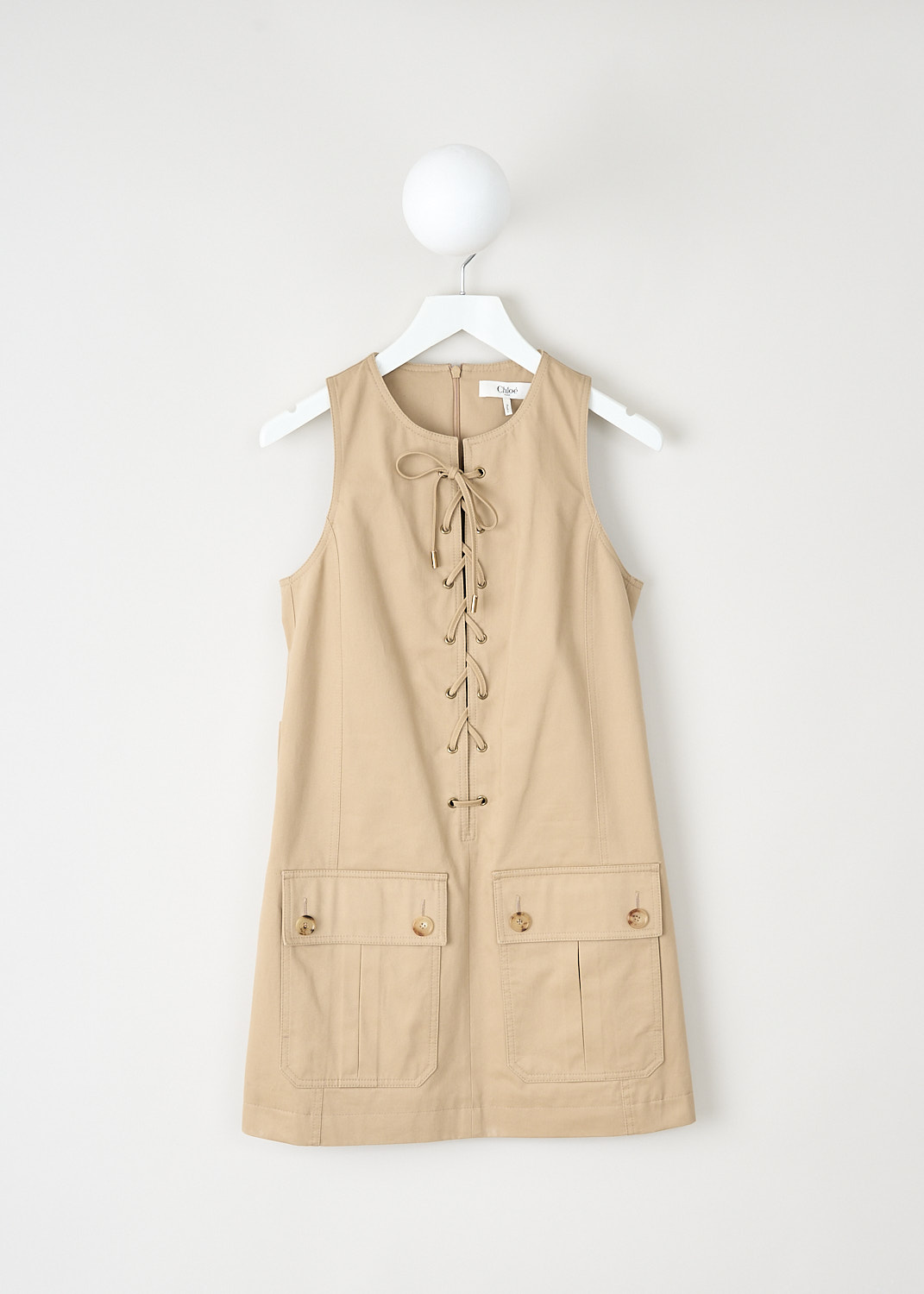 Chloé, Sleeveless mini dress in Argil brown, CHC25SRO36339_20G_ARGIL_BROWN, Brown, Front, This sleeveless mini dress in Argil brown has a round neckline and a front lace-up detail. On the front, the dress has two flap patch pockets. In the back, a concealed centre zip functions as thee closure. 