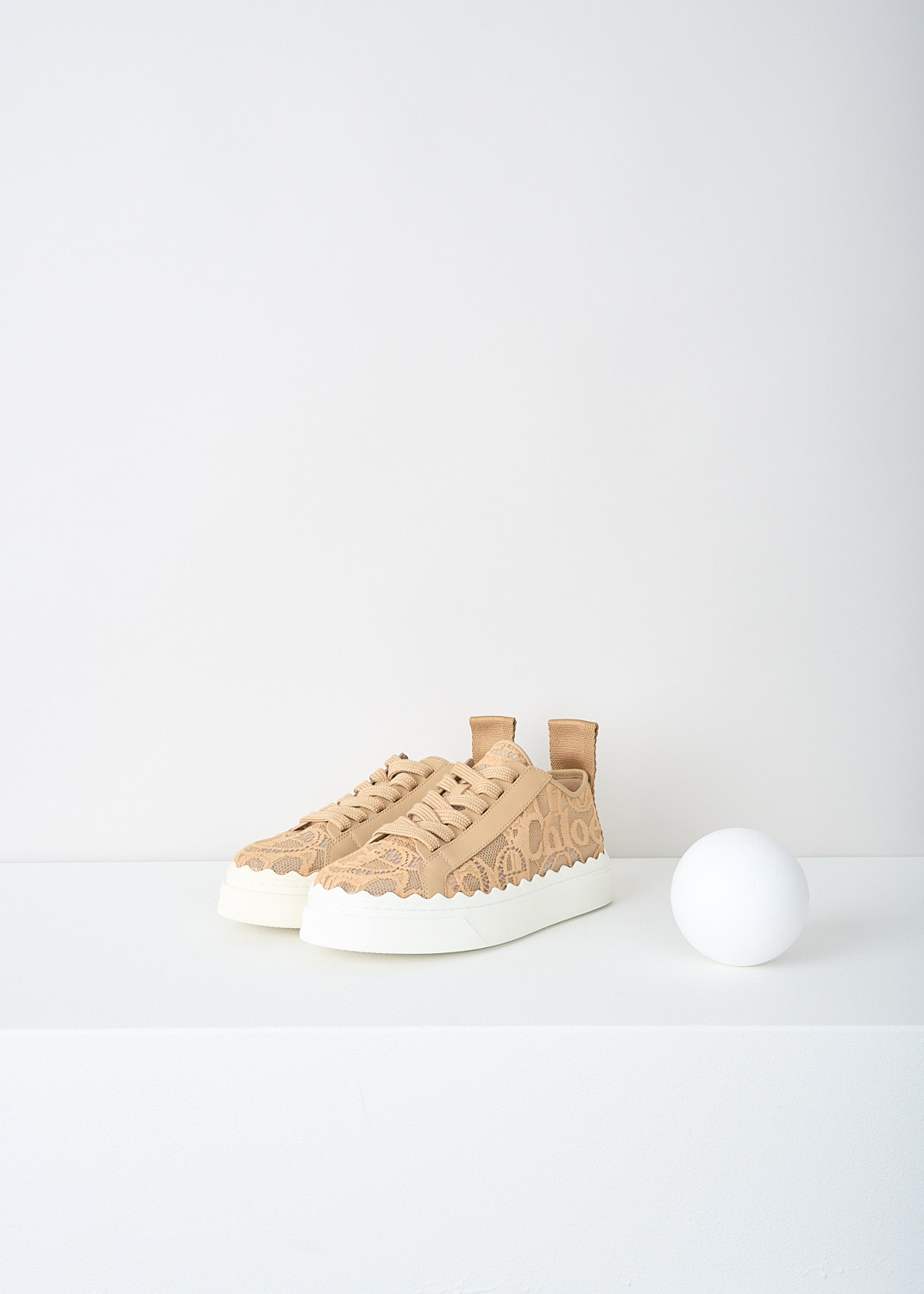 Chloé, Biscotti beige lace Lauren sneakers, CHC19U108D2268_BISCOTTI_BEIGE, Beige, Front, These Biscotti beige lace low-top Lauren sneakers have a lace closure. The white sole has a scalloped edge. These sneakers have a matching pull tab on the heel.
