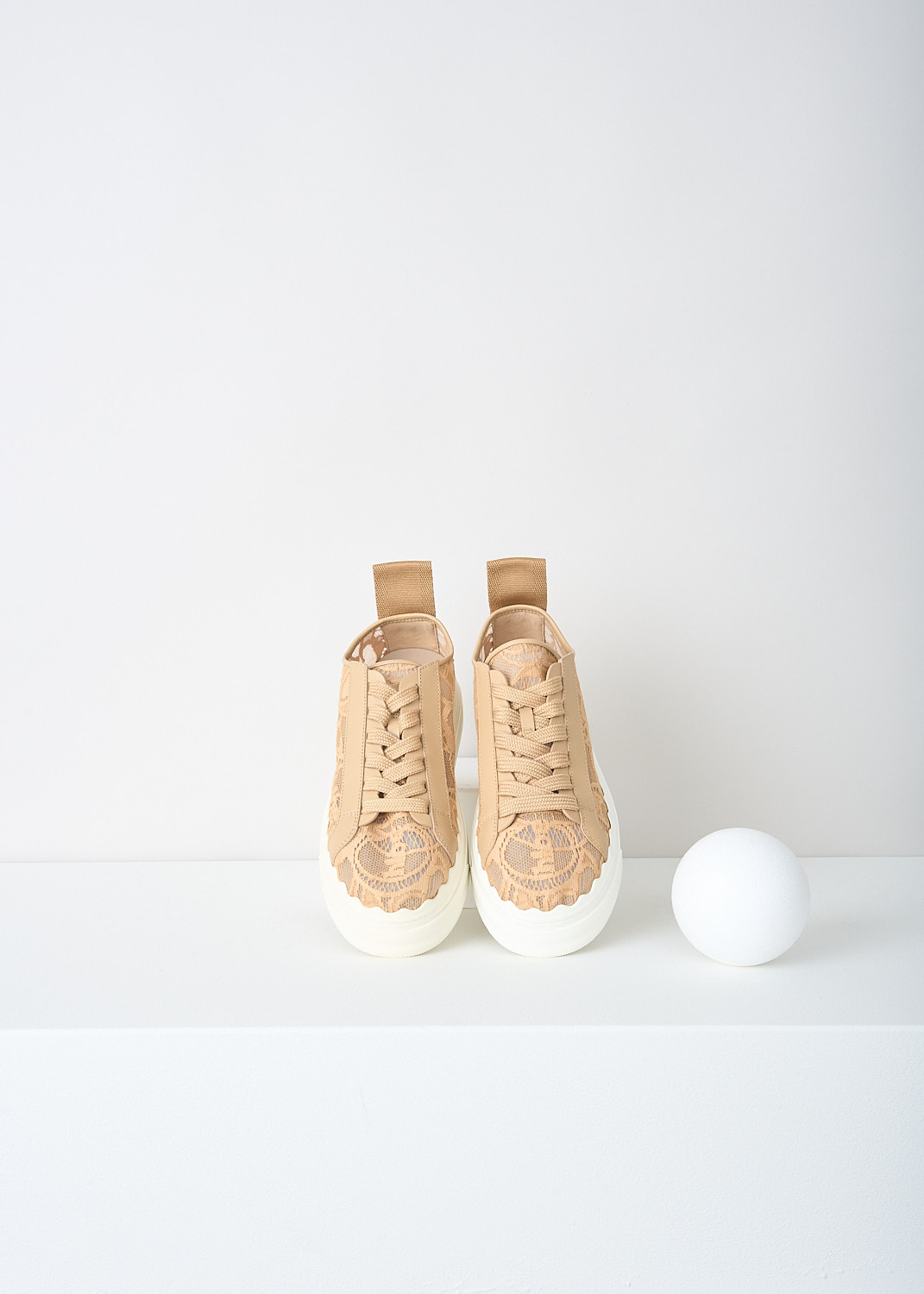 Chloé, Biscotti beige lace Lauren sneakers, CHC19U108D2268_BISCOTTI_BEIGE, Beige, Top, These Biscotti beige lace low-top Lauren sneakers have a lace closure. The white sole has a scalloped edge. These sneakers have a matching pull tab on the heel.

