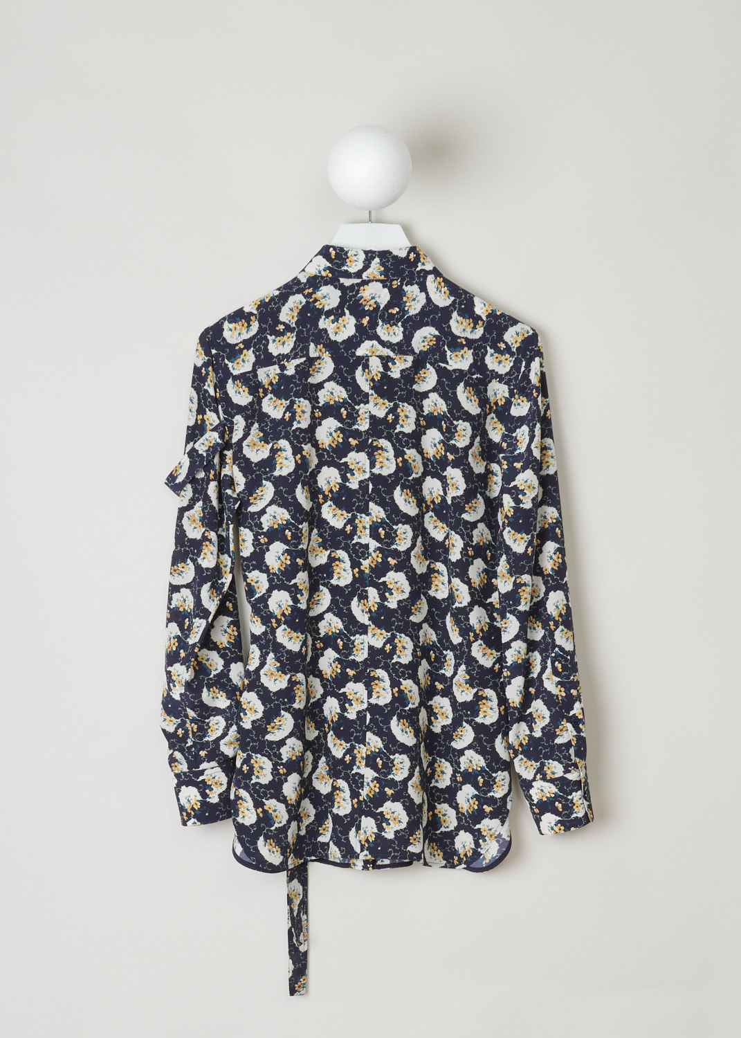ChloÃ©, Navy blouse decorated with a colorful floral pattern, CHC20SHT40335476_476_dark_night_blue, blue, print, back, A silk crepe blouse adorned with a floral pattern in cream, yellow and green. Featuring a pointed collar which is accompanied by self-tie detail. a similar self-tie feature can be found on waist height and adds more excitement to this blouse. The fastening option here are the concealed buttons on the front.  