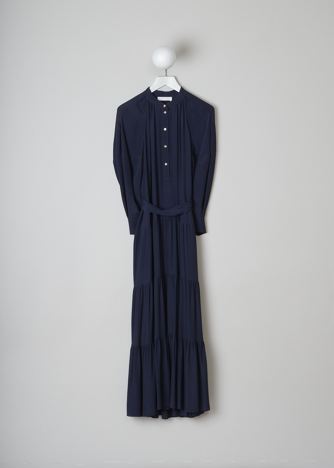 CHLOÃ‰, INK NAVY GATHERED CREPE MAXI DRESS, CHC21SRO020324C3_INK_NAVY,  Blue, Front, This Inky Navy dress has a mandarin collar with a front button placket with gold-tone buttons that reaches halfway down the pleated bodice. The long balloon sleeves have buttoned cuffs with those same gold-tone buttons. A matching detachable fabric belt can be used to cinch in the waist. The dress has a tiered maxi skirt with two side slanted pockets.
