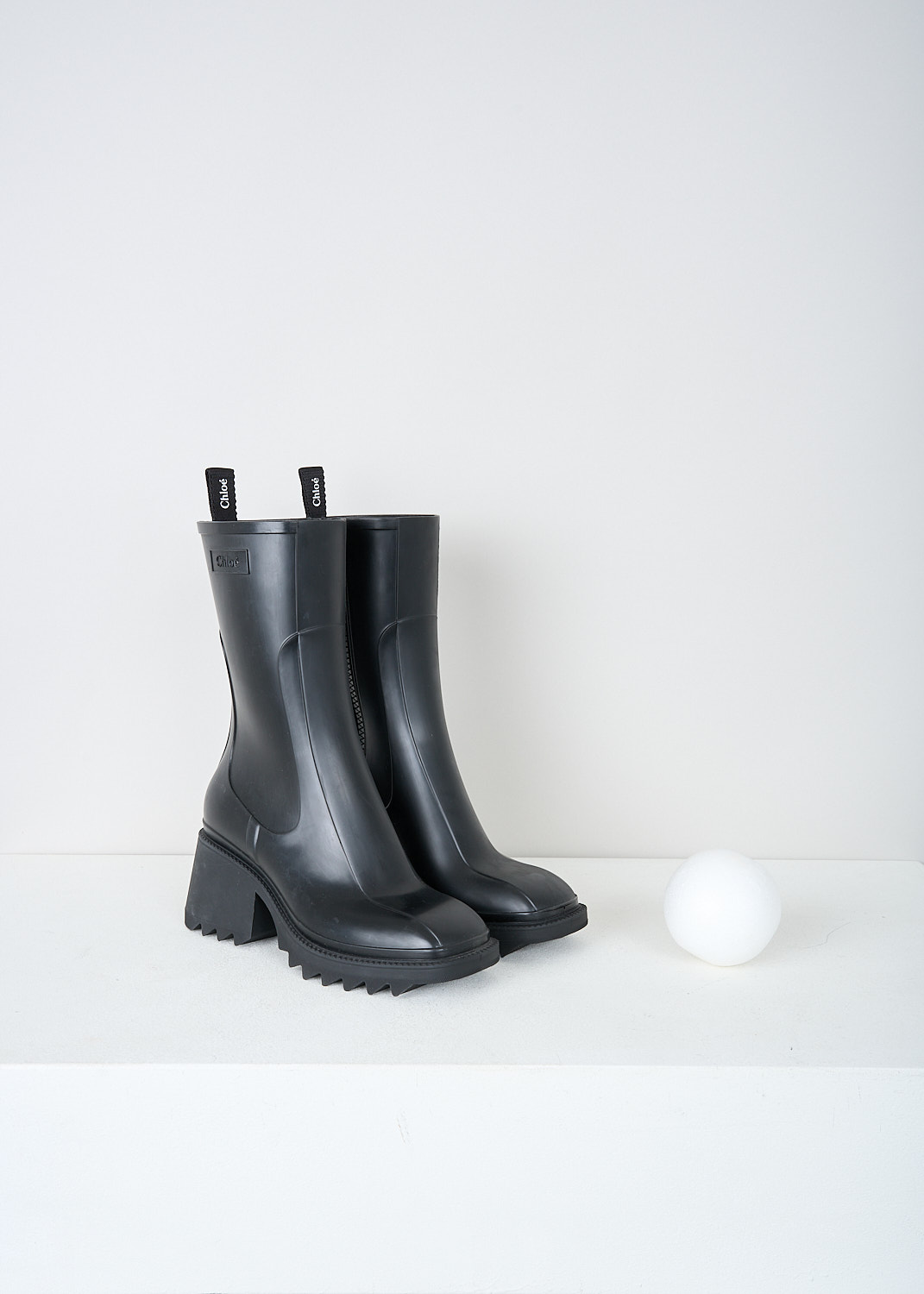 Chloé, Black Betty rain boots, CHC22A239Z2001_BETTY_RAINBOOTS, Black, Front, These black Betty rain boots have a side zipper and a pull tab on the back top edge. The brand's logo can be found debossed on the outside. These boots have a rounded square toe, ridged soled and a blocked heel. 

