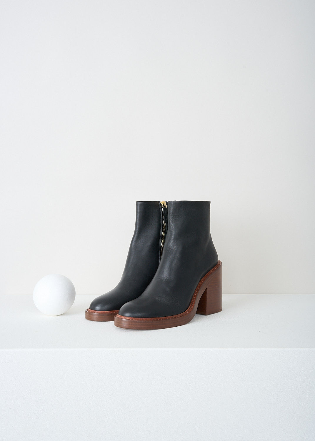 Chloé, Black ankle boots with brown sole, CHC22A69484001_BLACK, Black, Brown, Front, These black ankle boots have a zip closure on the inside of the leg. These boots have a round toe and a brown stacked block heel.
