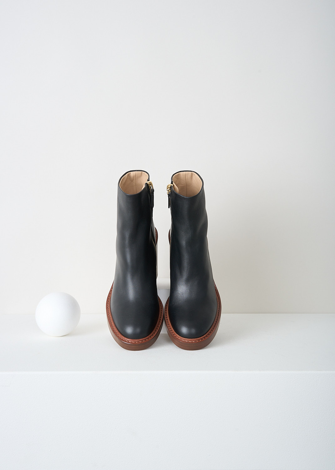 Chloé, Black ankle boots with brown sole, CHC22A69484001_BLACK, Black, Brown, Top, These black ankle boots have a zip closure on the inside of the leg. These boots have a round toe and a brown stacked block heel.
