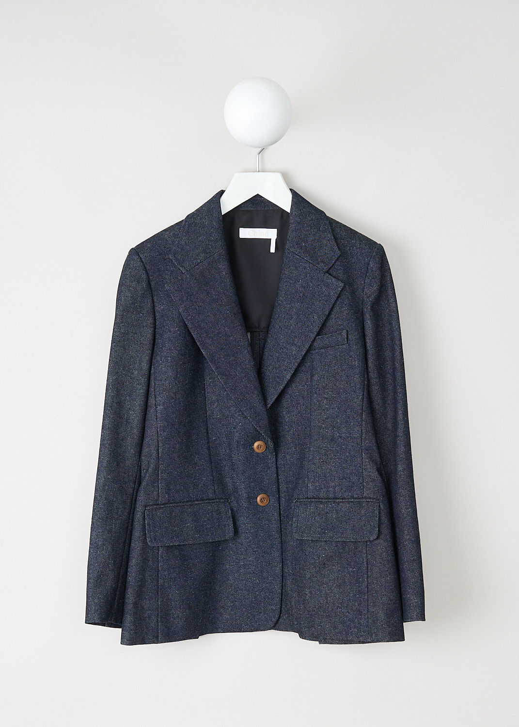 Chloé, Iconic navy denim jacket, CHC22ADV6115748A_ICONIC_NAVY, Blue, Front, This iconic navy single-breasted denim jacket has a notched lapel and a front button closure. The long sleeves have buttoned cuffs. The jacket has a single breast pocket and two flap welt pockets. The jacket has a straight hemline with a double vent. The jacket is fully lined.


