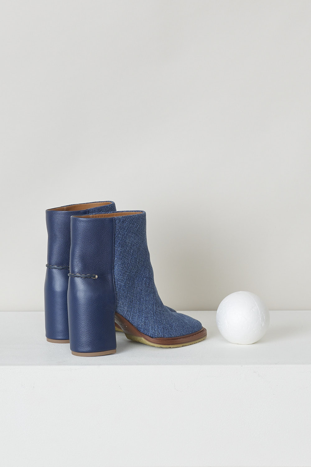 CHLOÃ‰, NAVY BLUE DENIM ANKLE BOOTS, CHC22S521X145C, Blue, Back, These dark navy denim slip-on ankle boots have a blue leather-clad block heel with white stitching on the ankle. The boots have a round toe and a contrasting brown sole. 

