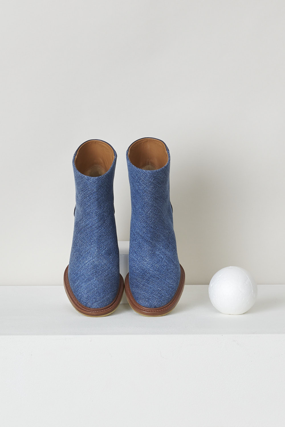 CHLOÉ, NAVY BLUE DENIM ANKLE BOOTS, CHC22S521X145C, Blue, Top, These dark navy denim slip-on ankle boots have a blue leather-clad block heel with white stitching on the ankle. The boots have a round toe and a contrasting brown sole. 

